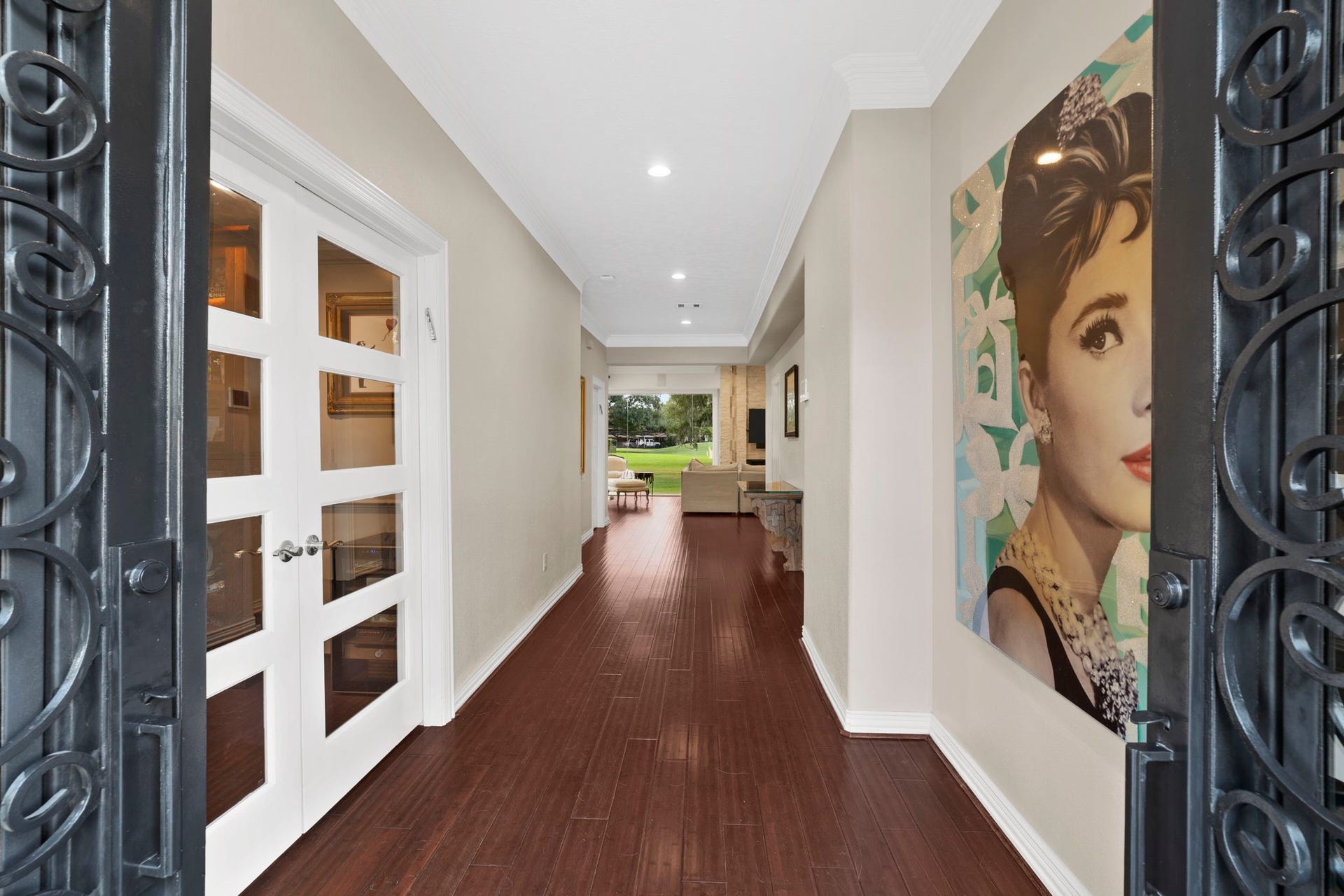 9 Charleston Street S, Sugar Land, TX 77478 A wide, open central hallway creates a welcoming sense of arrival, with the home office thoughtfully positioned to the left.