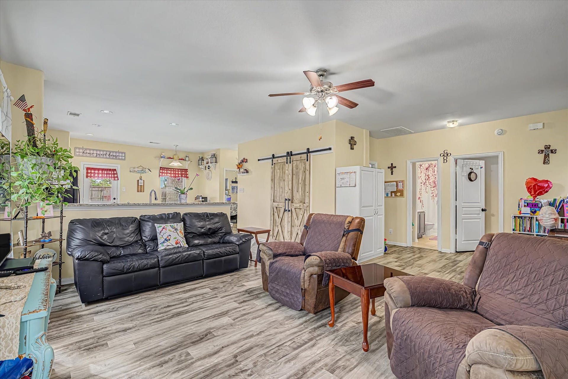 4914 Seaside Sparrow Lane, Baytown, TX 77521 The living room offers upgraded flooring and tons of natural light.