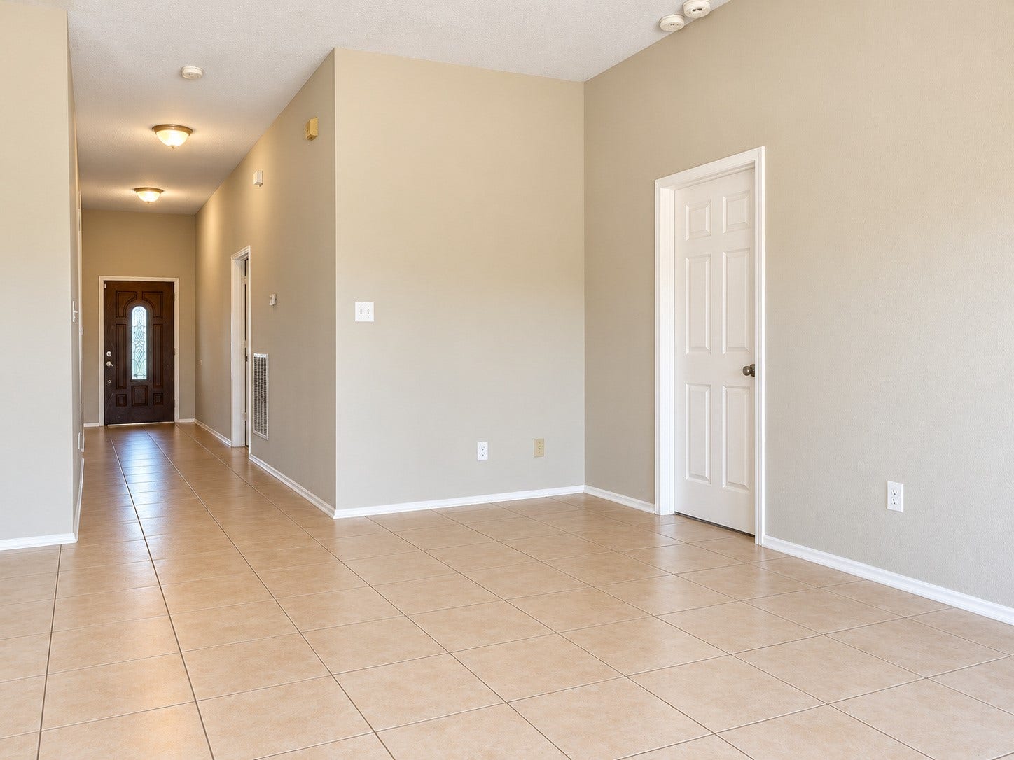 5007 Chase Mountain Drive, Bacliff, TX 77518 Looking back from family room with entry to primary on the right.
