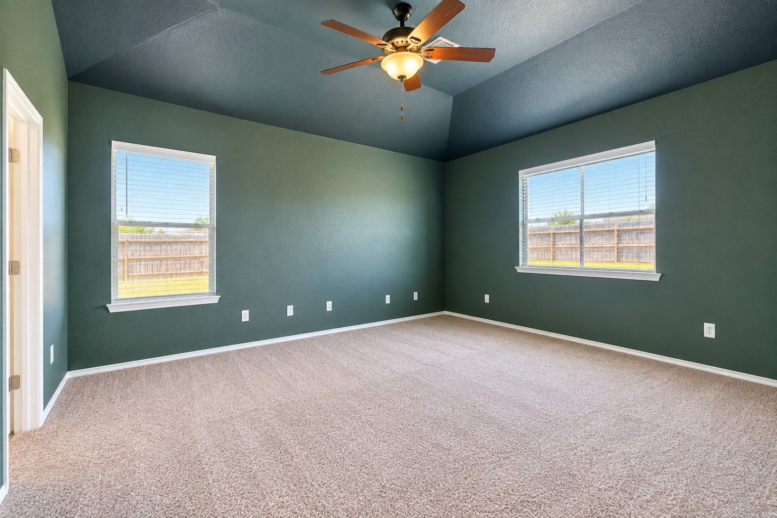5007 Chase Mountain Drive, Bacliff, TX 77518 Large primary bedroom looking out to backyard. New carpet.