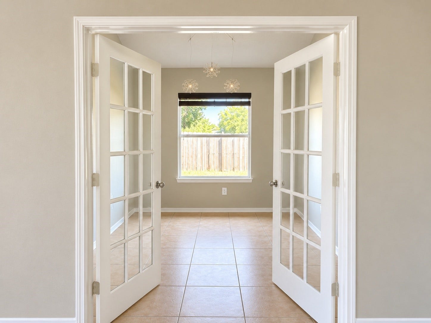 5007 Chase Mountain Drive, Bacliff, TX 77518 Office has beautiful French doors looks out into the backyard.