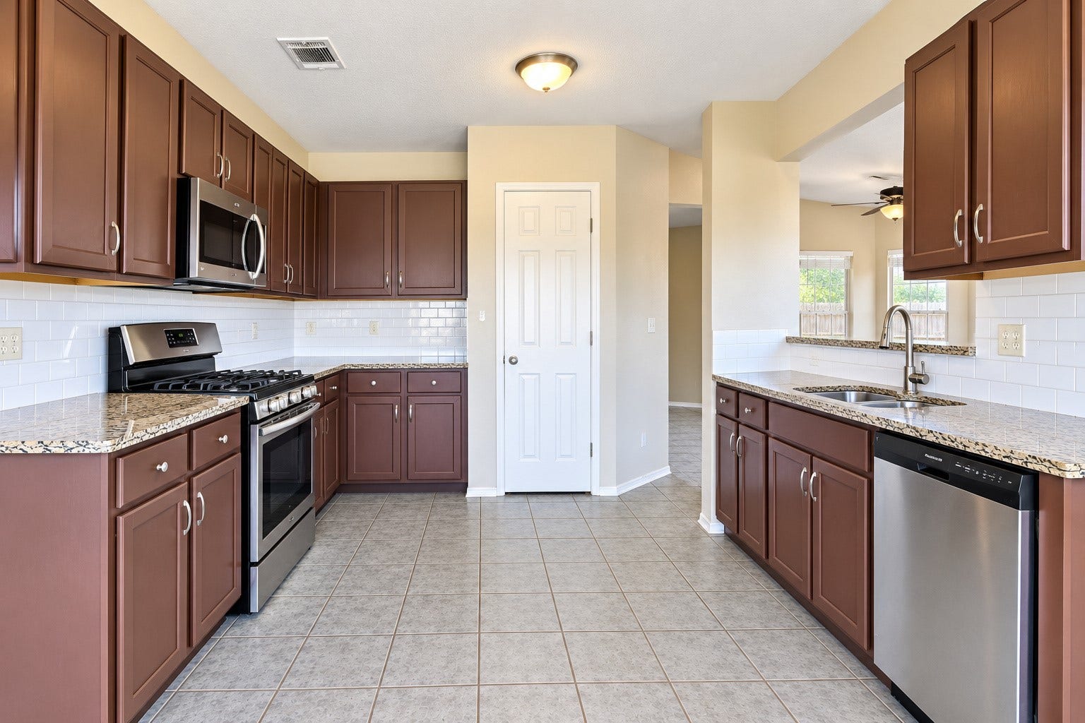 5007 Chase Mountain Drive, Bacliff, TX 77518 Spacious kitchen with granite counter tops and plenty of cabinets.