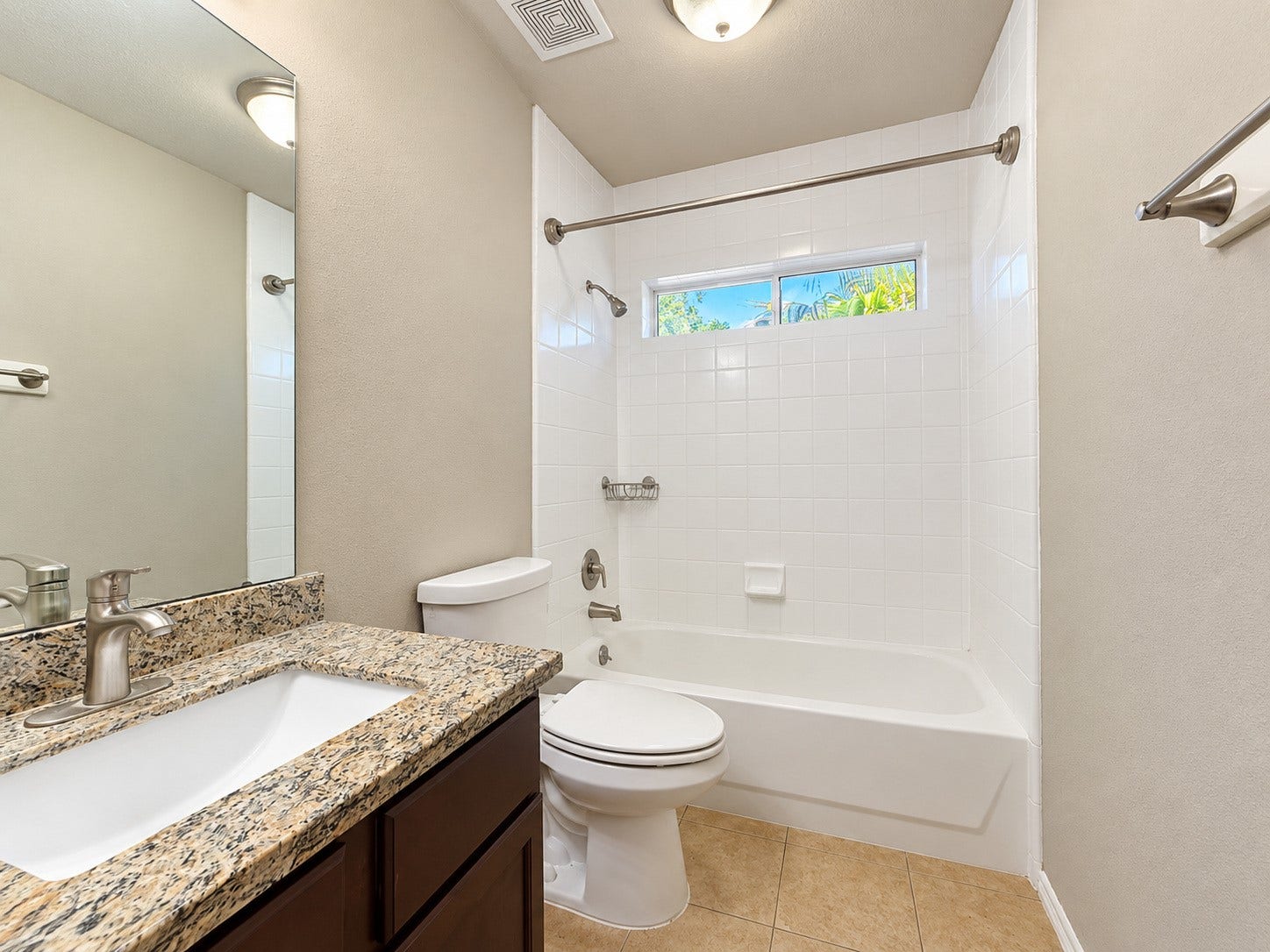 5007 Chase Mountain Drive, Bacliff, TX 77518 Secondary bathroom with granite counter top that matches the kitchen and primary bathroom countertops.