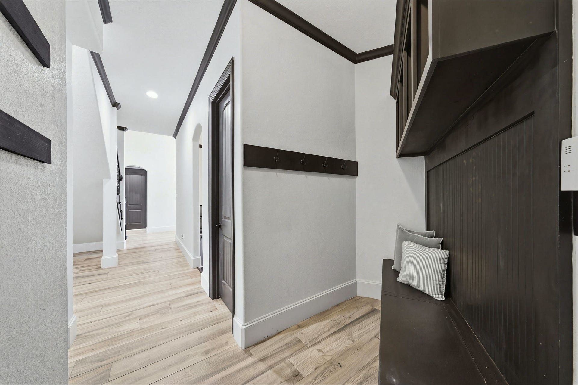 32703 Wales Circle, Fulshear, TX 77441 A spacious mudroom offers a convenient drop zone for shoes, bags, and everyday essentials, helping keep the rest of the home organized.
