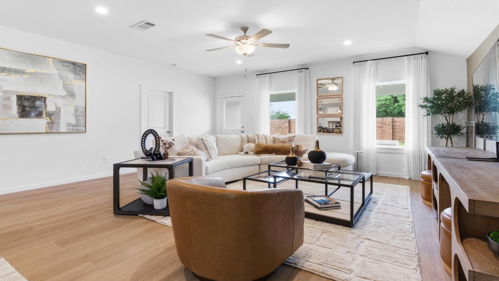 14223 Starboard Reach Drive, Texas City, TX 77510 A well-organized living room that includes a kitchen and dining area, creating a warm and welcoming environment for gatherings.