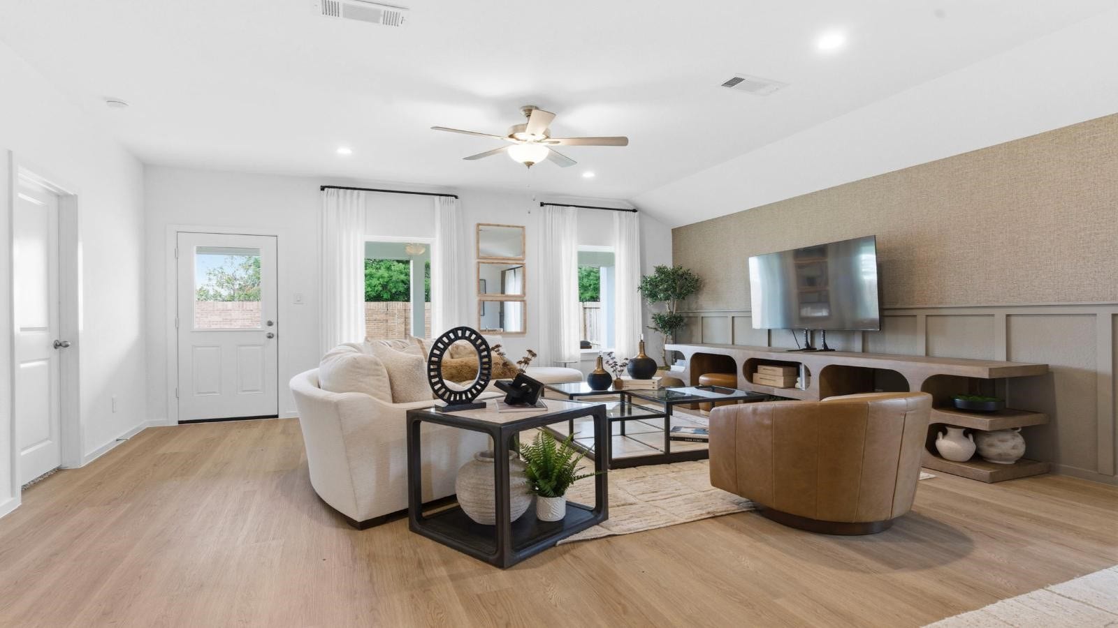 14223 Starboard Reach Drive, Texas City, TX 77510 A cozy living room featuring a comfortable couch, a stylish coffee table, and an elegant painting on the wall.