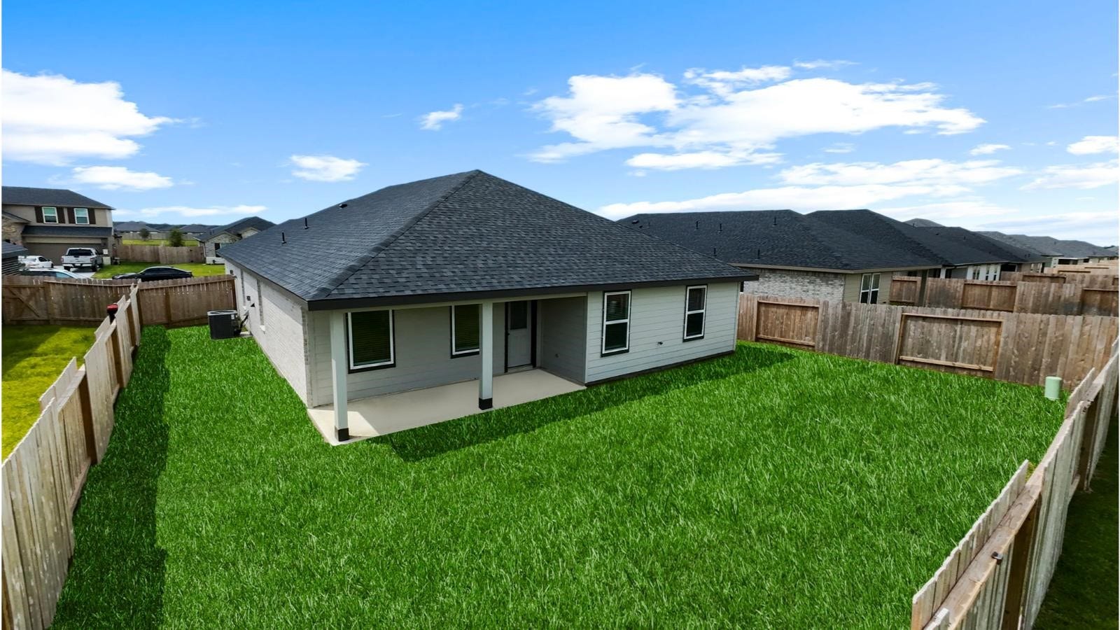 14223 Starboard Reach Drive, Texas City, TX 77510 Large fenced-in backyard with a covered patio, perfect for outdoor entertaining.