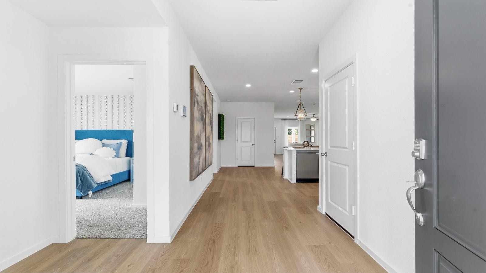 14223 Starboard Reach Drive, Texas City, TX 77510 Entry hallway leading to living room and kitchen in the background.