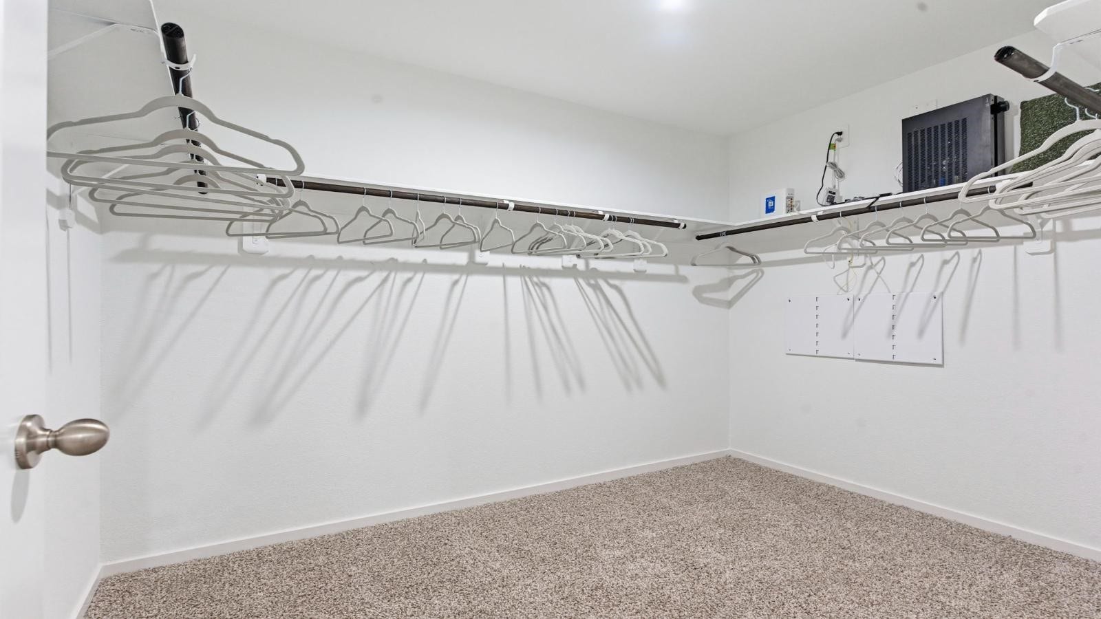 14223 Starboard Reach Drive, Texas City, TX 77510 A spacious walk-in closet off the primary bathroom with multiple hanging rods, and shelves for maximum storage capabilities.
