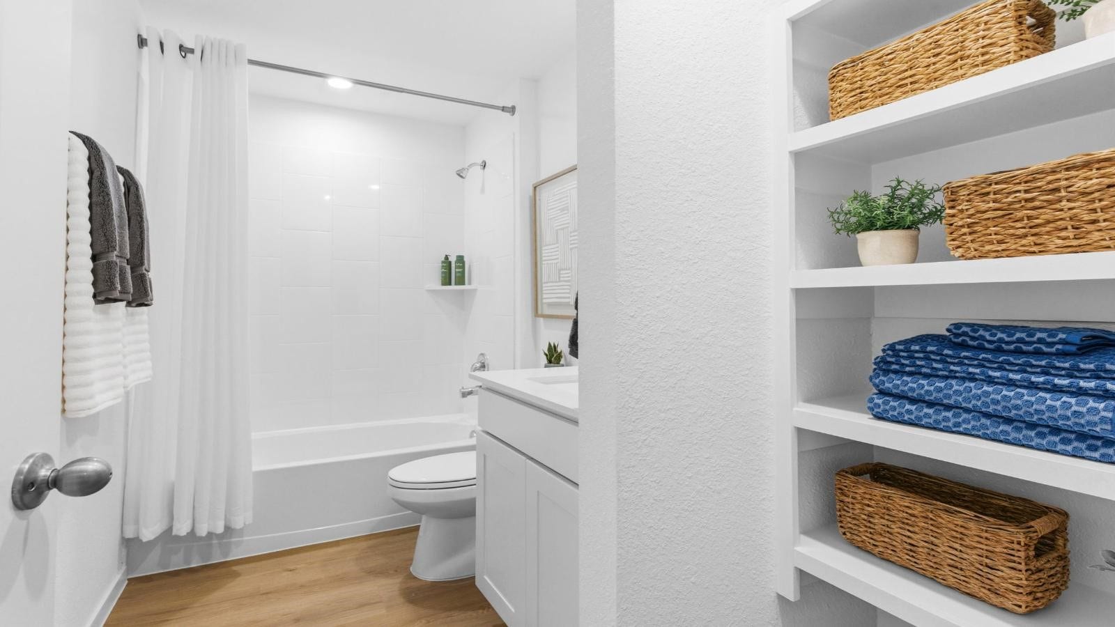 14223 Starboard Reach Drive, Texas City, TX 77510 A well-designed bathroom equipped with quartz countertops, a standing tub, and a single vanity.