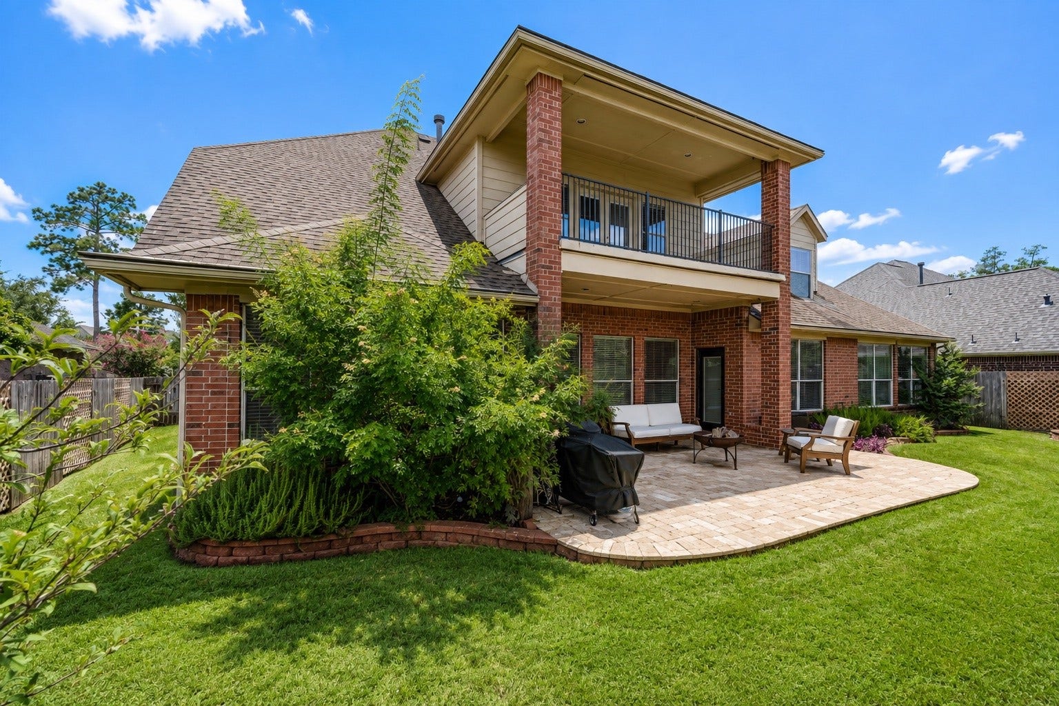 20722 Windrose Bend Drive, Spring, TX 77379 Fenced backyard with professional low-maintenance landscaping