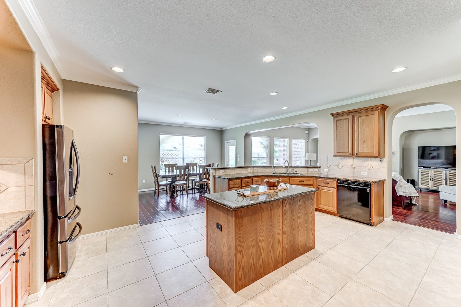 20722 Windrose Bend Drive, Spring, TX 77379 Large island with bar seating makes the kitchen a natural gathering spot