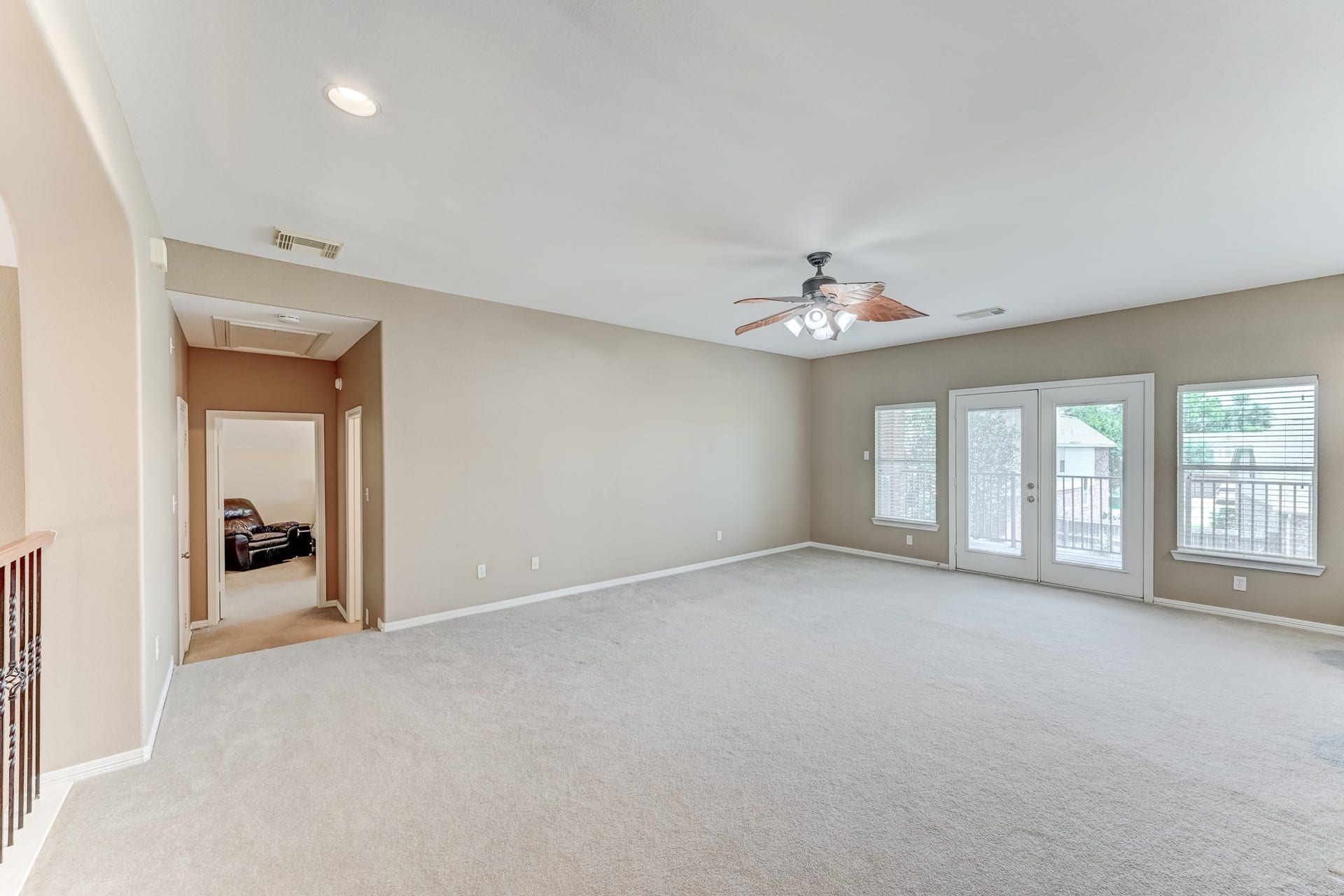 20722 Windrose Bend Drive, Spring, TX 77379 French doors extend the upstairs living space outdoors