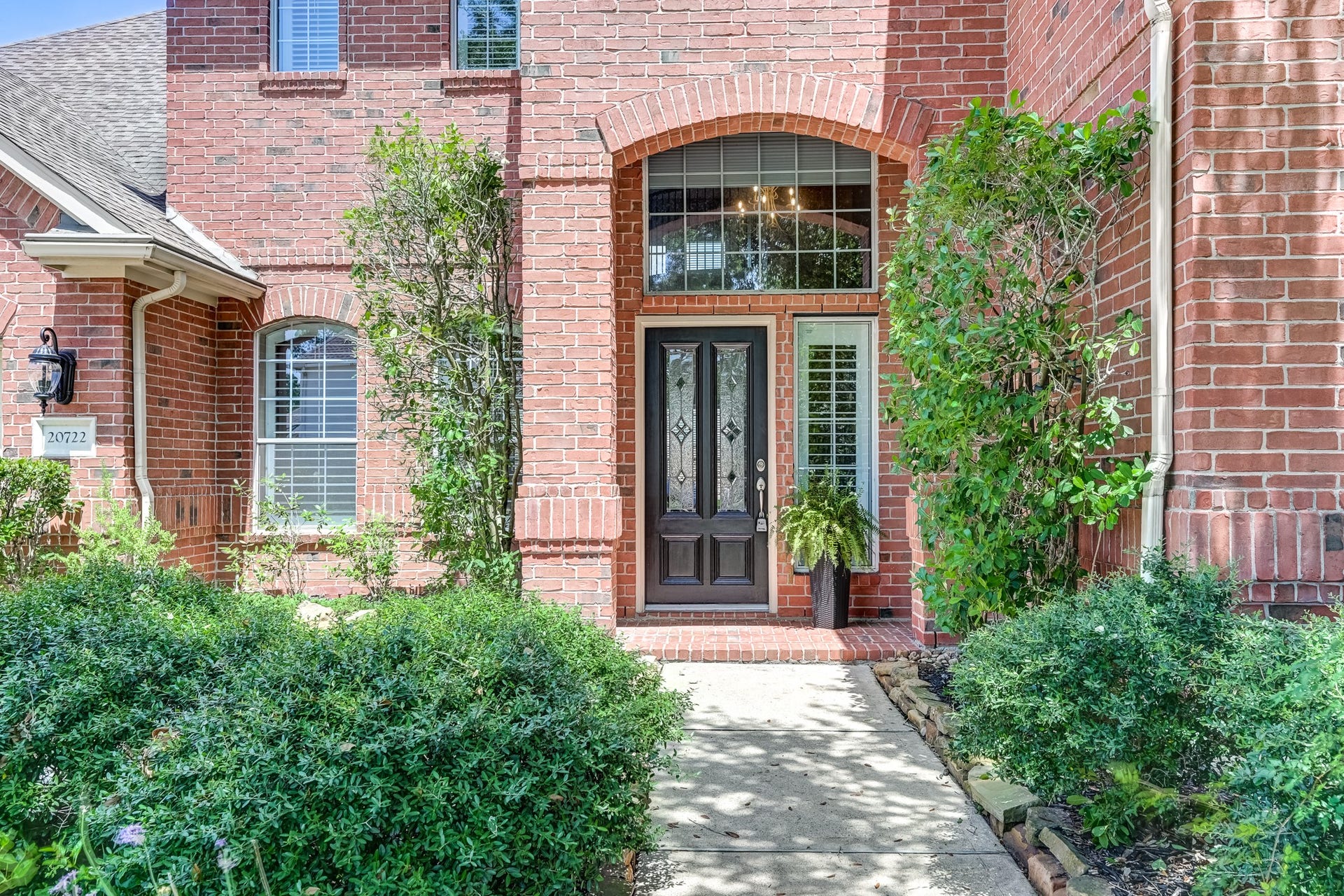 20722 Windrose Bend Drive, Spring, TX 77379 Impressive brick entry welcomes you home