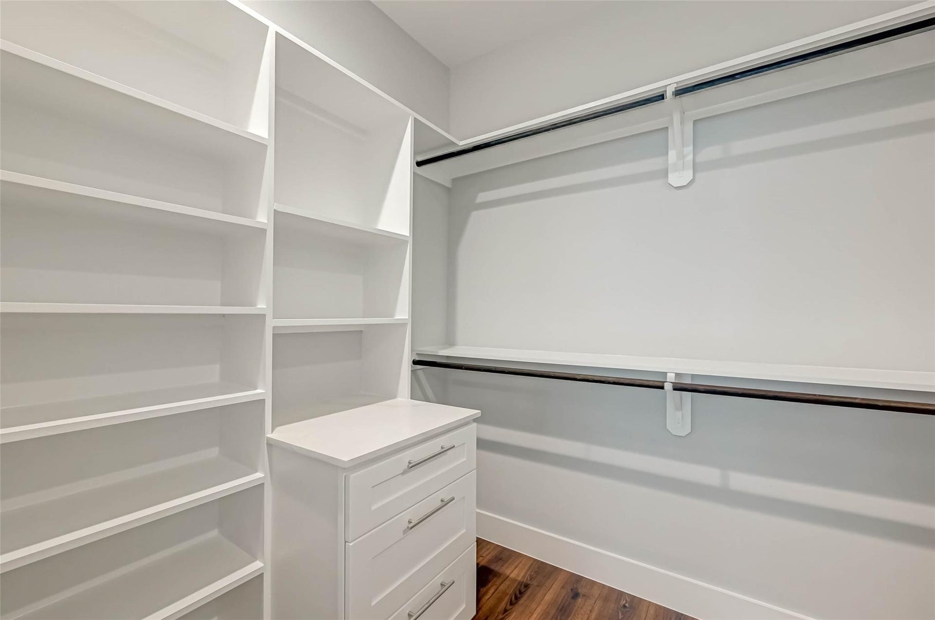 1116 Bennington Street, Houston, TX 77022 Well-designed and spacious primary closet optimized for maximum storage with extensive shelving, hanging space and built-ins. **Photo from previous listing**