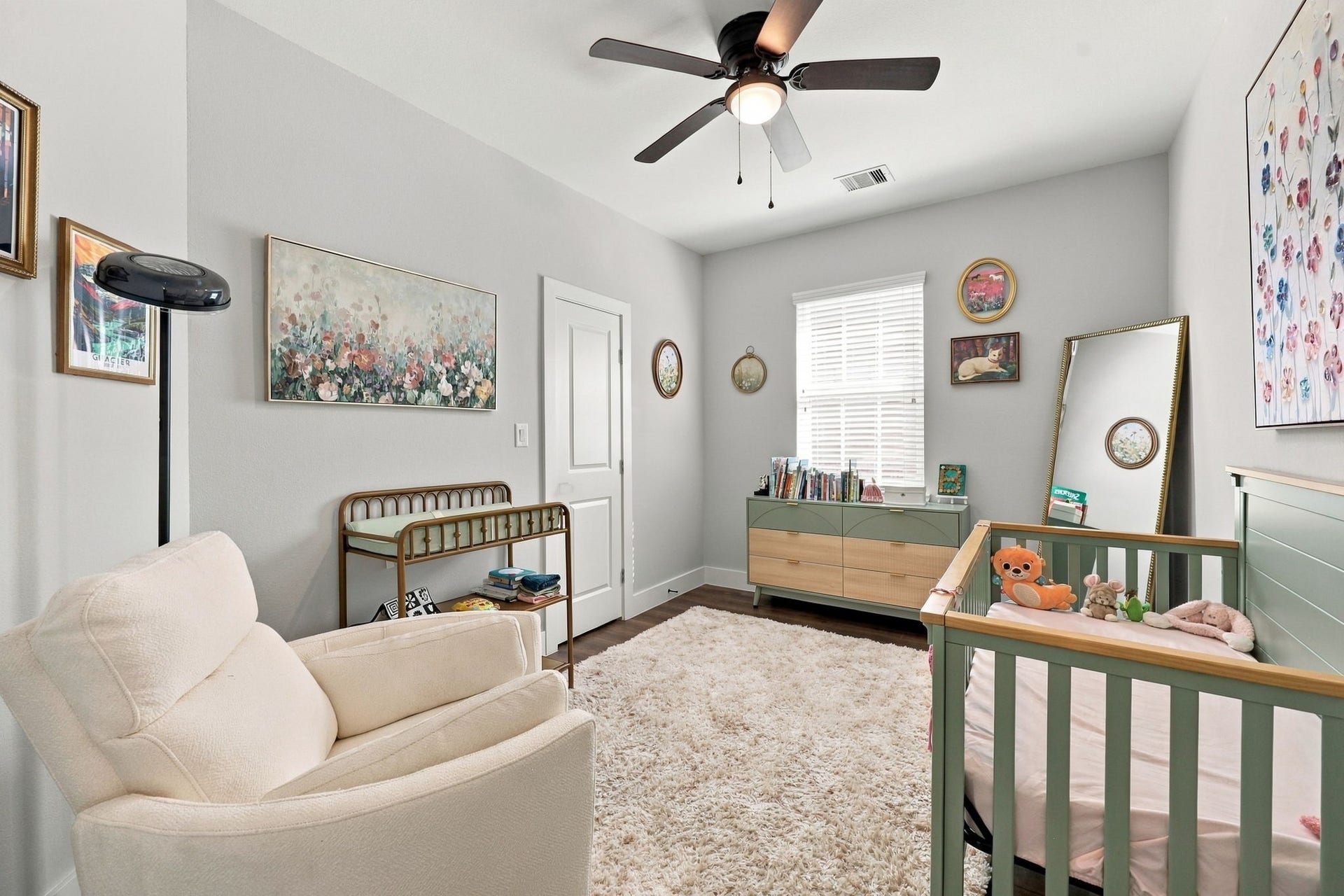 1116 Bennington Street, Houston, TX 77022 Bedroom #4 - Charming secondary bedroom with closet and ceiling fan, currently serving as a bright and inviting nursery.
