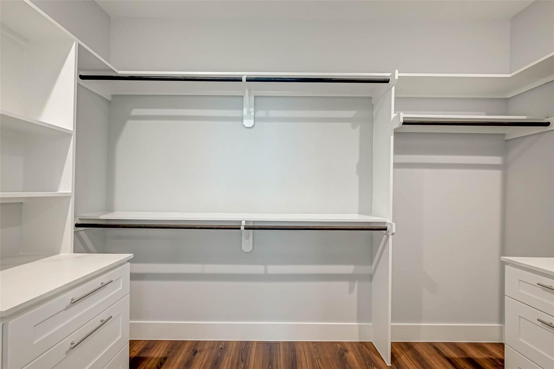 1116 Bennington Street, Houston, TX 77022 Primary walk-in closet featuring custom shelving, ample hanging space and built-in drawer storage. **Photo from previous listing**