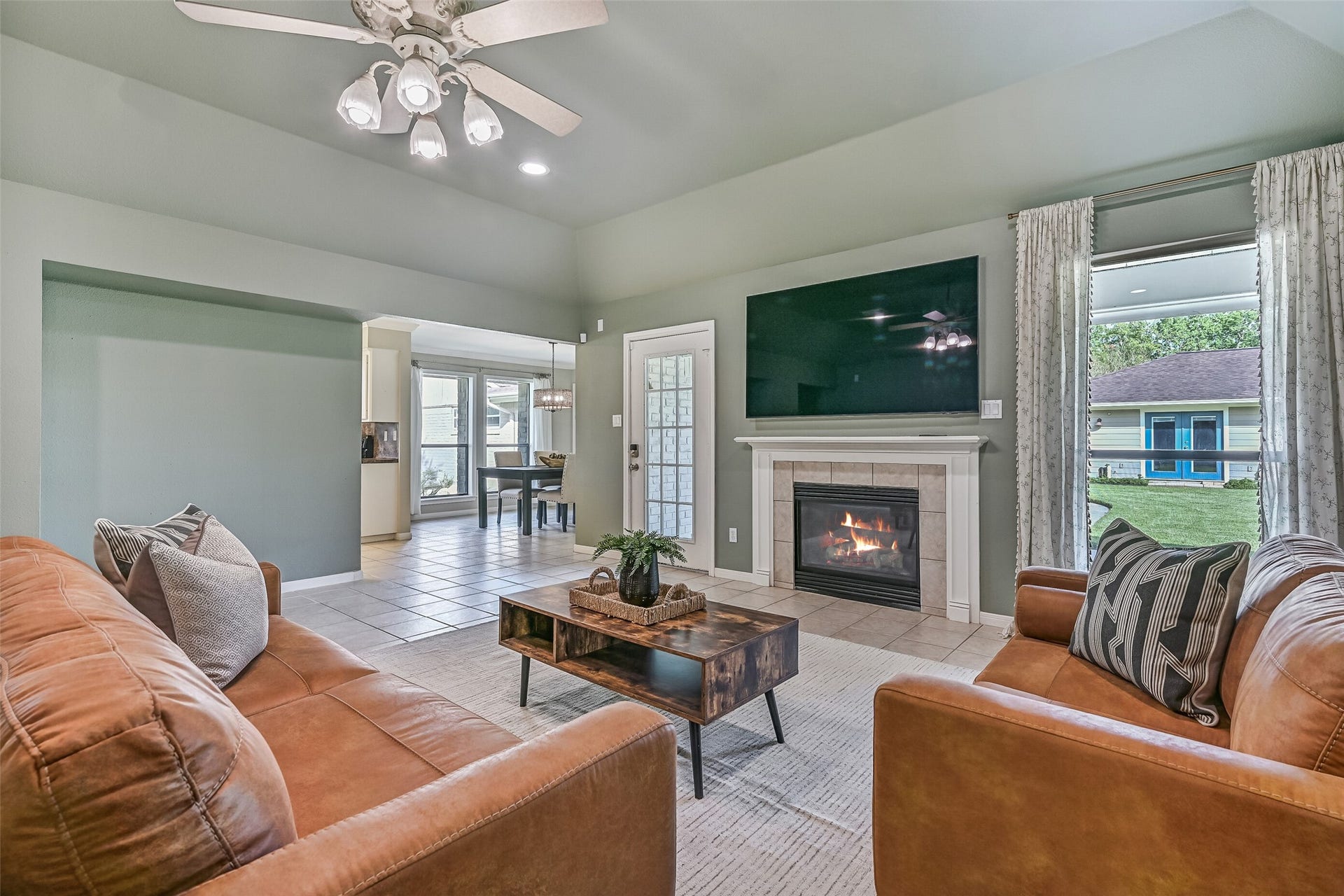 304 Chester Drive, Friendswood, TX 77546 Living Area Second Residence:
The open living area with a vaulted ceiling, recessed lighting, and a lighted ceiling fan, makes a seamless transition into the dining area and kitchen. The step-free layout enhances ease of movement while maintaining clear sightlines.