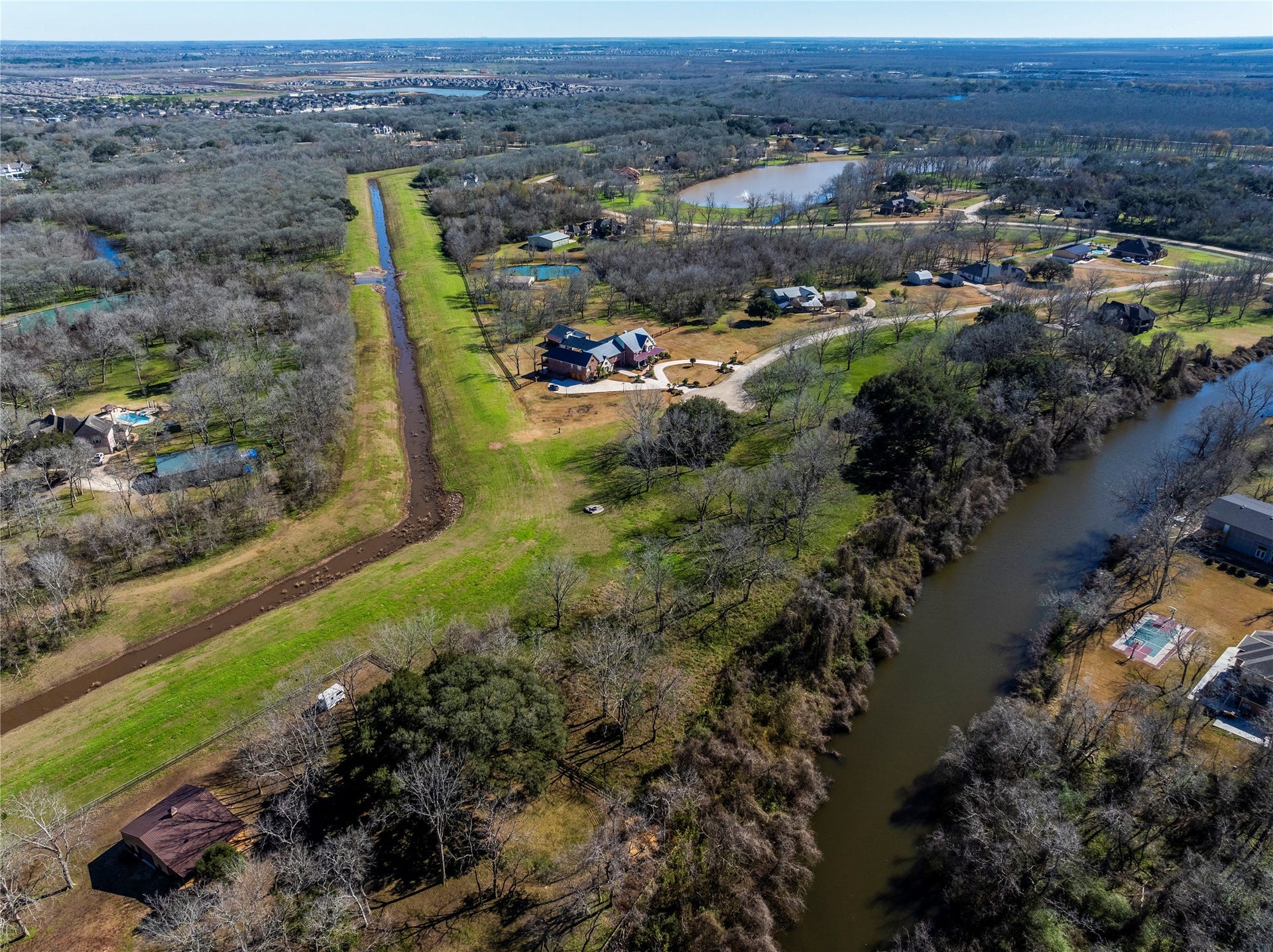 606 Oyster Shell Court, Missouri City, TX 77459 The smaller creek provides a natural barrier to avoid anyone else building behind the property