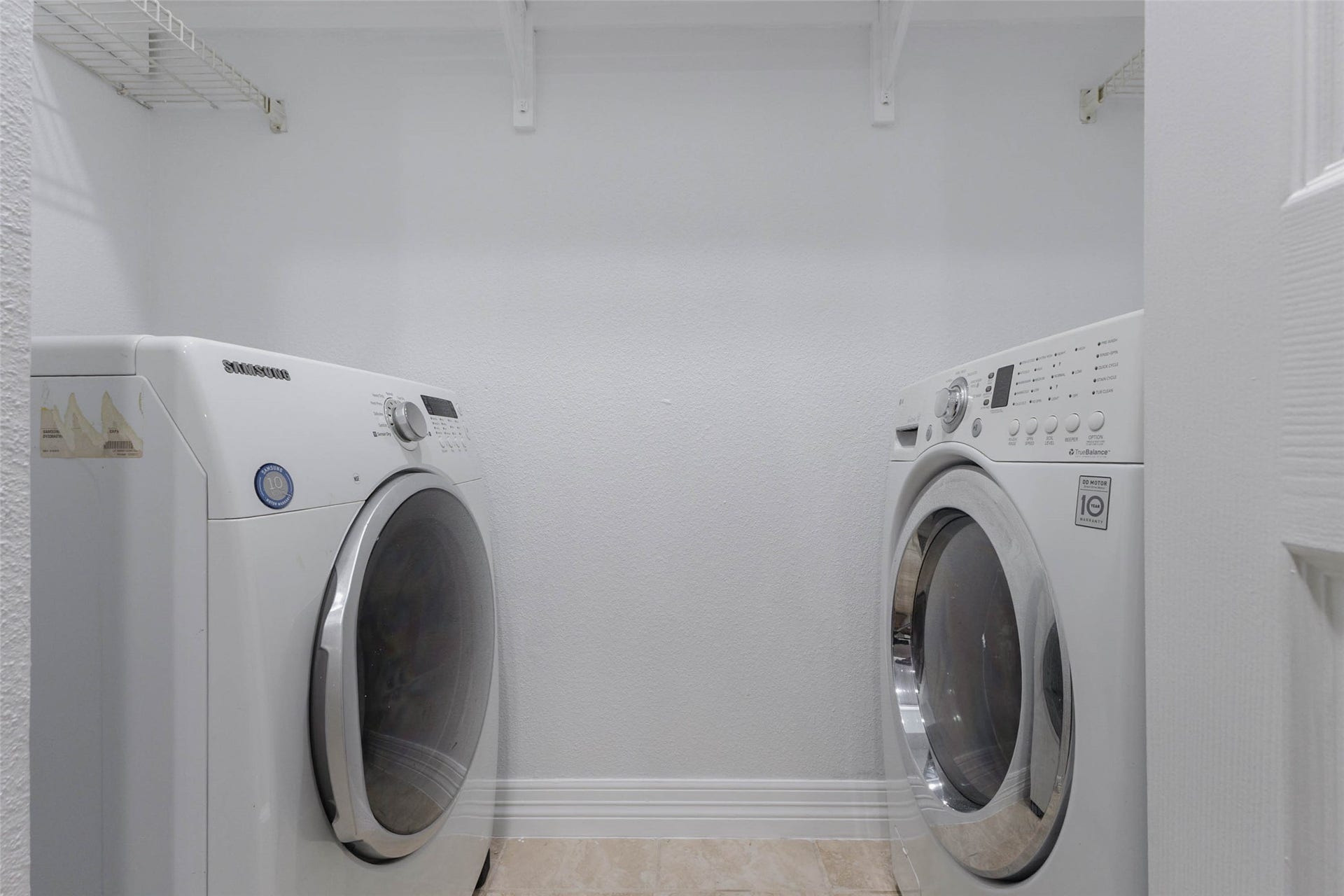 2800 Jeanetta Street, #2207, Houston, TX 77063 Convenient laundry room with modern front-loading washer and dryer, ample storage space, and bright, clean finishes.