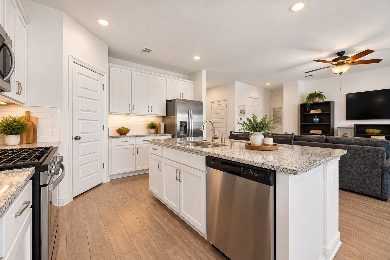 Kitchen is open to family room for an open, airy feel, and perfect for entertaining.