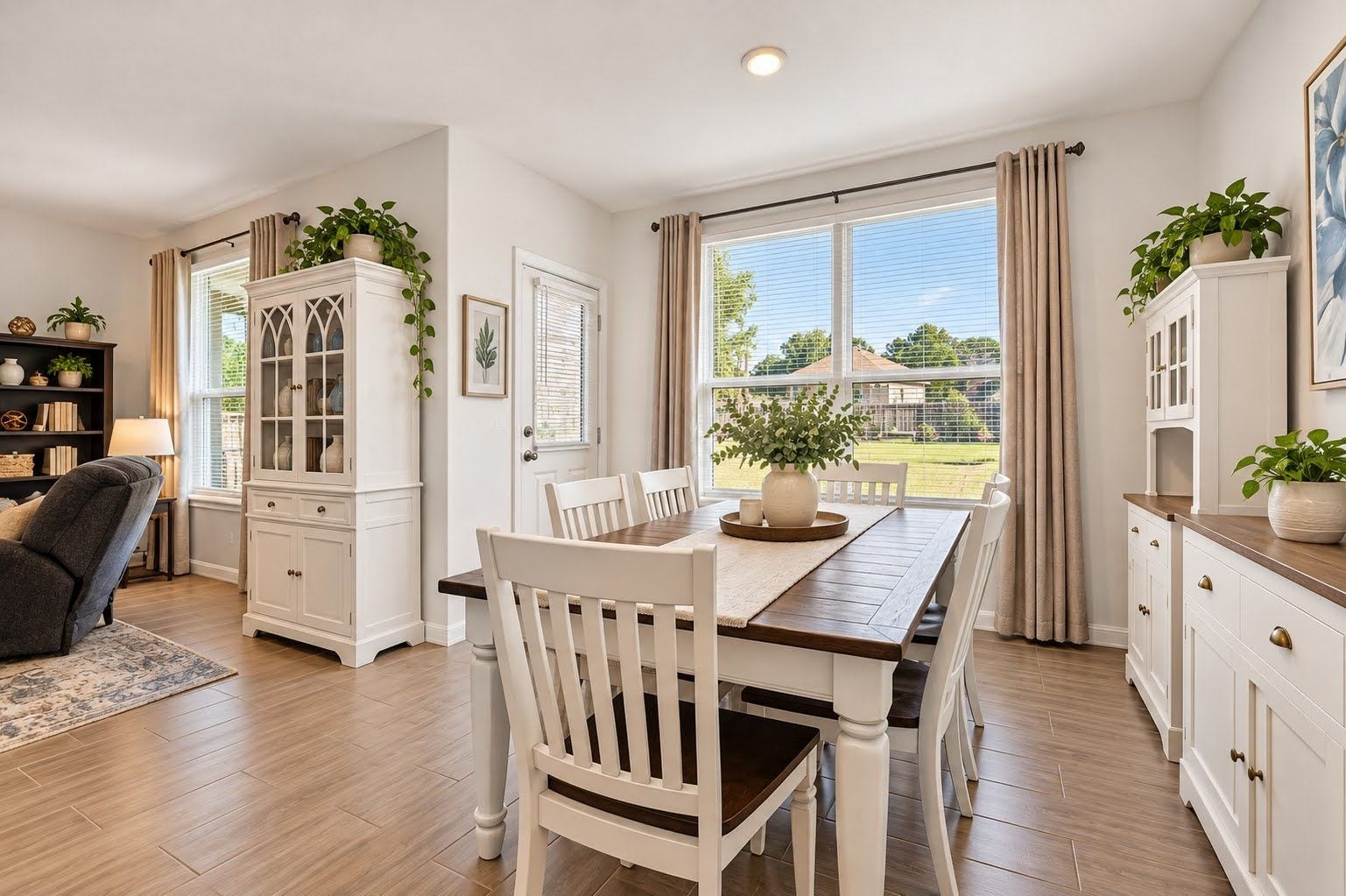 Breakfast area and living room look out onto large private yard.
