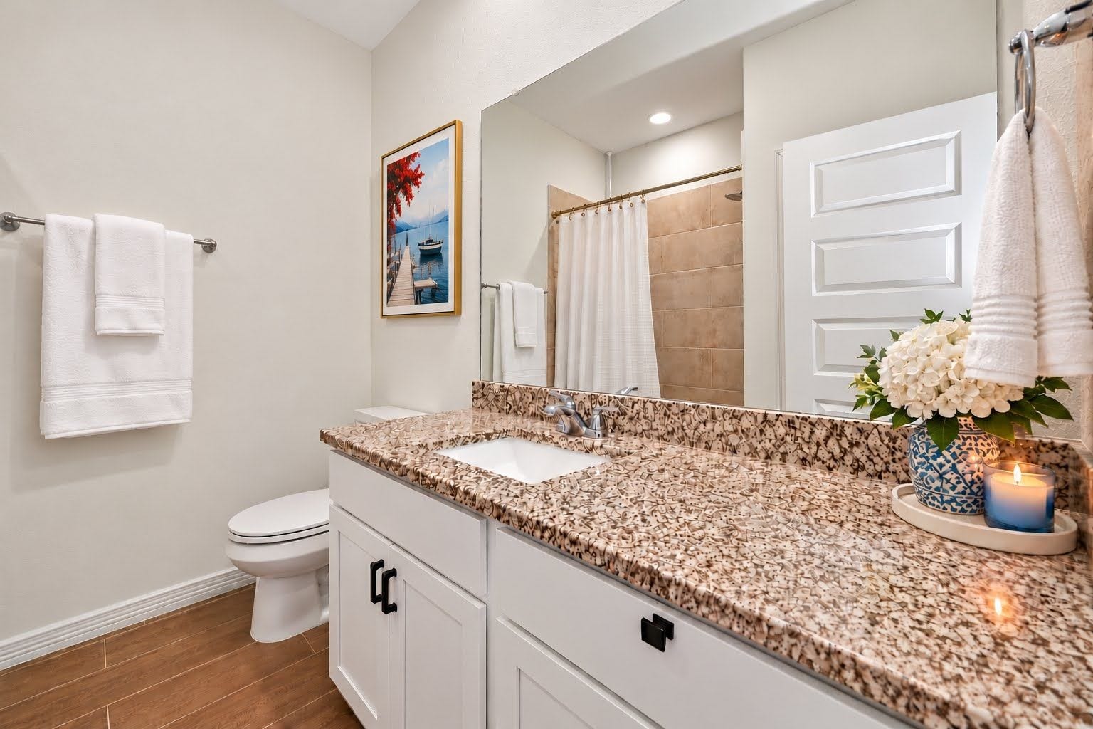 Secondary bathroom with granite counter top, and lots of counter space.