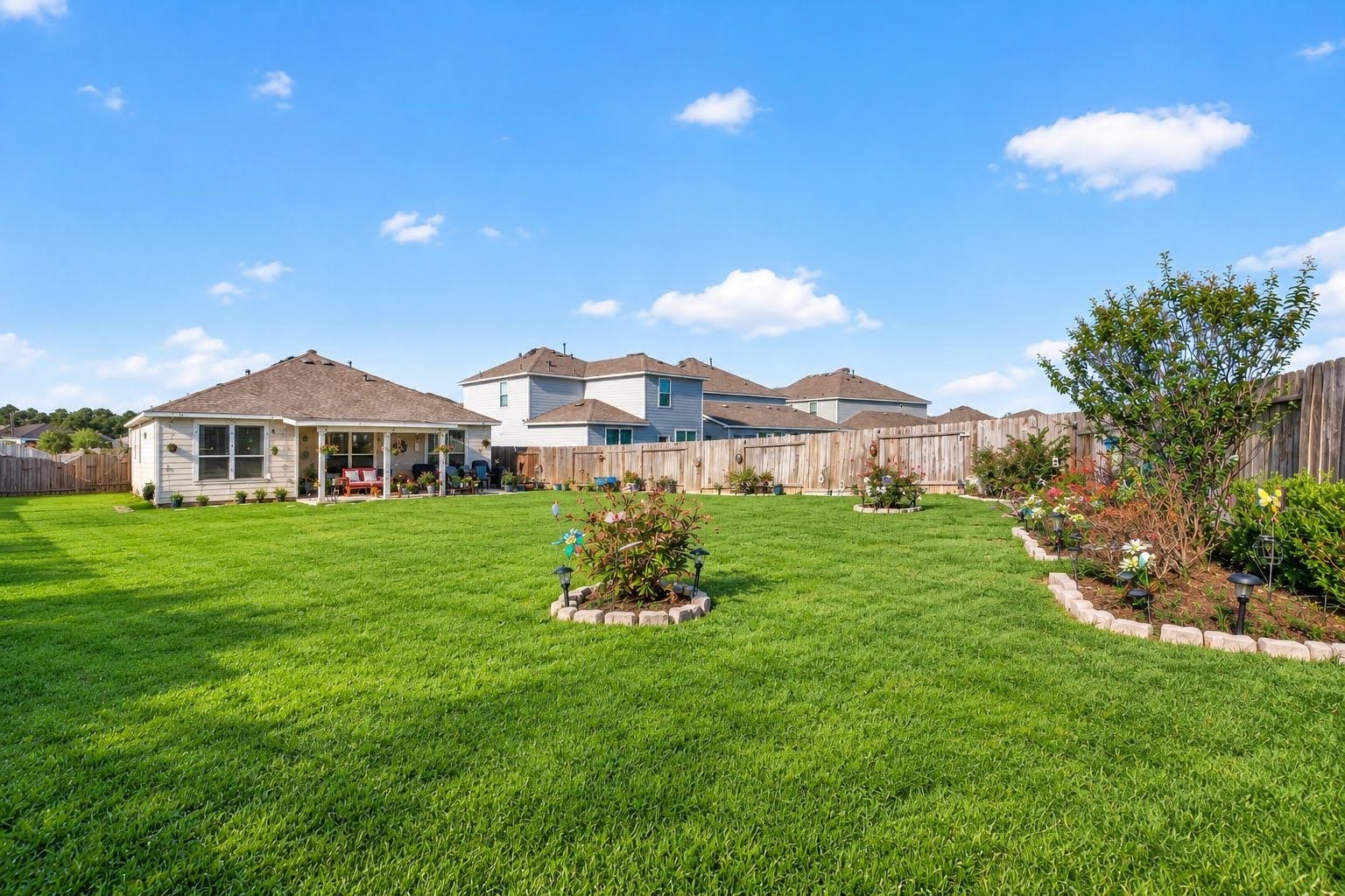 Look at the size of this yard!  Big enough to run, play baseball, or football !