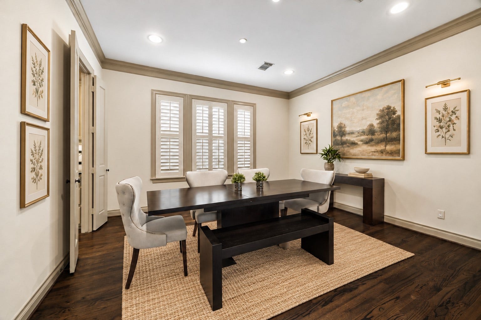 1311 N Jordan Cove, Houston, TX 77055 Elegant light-filled formal dining room thoughtfully positioned to the right of entry, creating a wonderful flow for entertaining. Three large windows w/ plantation shutters fill the space w/ natural light while hardwood flooring, crown molding & recessed lighting enhance the timeless design. Generous proportions provide plenty of room for large dining furnishings. Virtually staged.