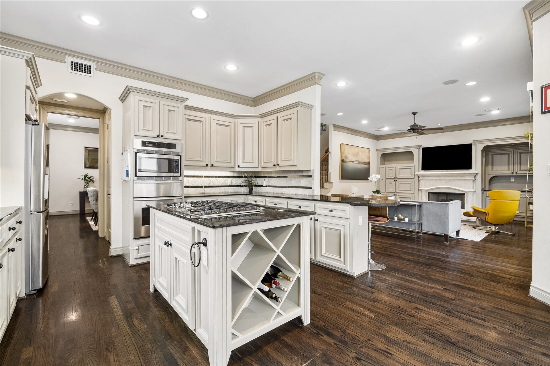 1311 N Jordan Cove, Houston, TX 77055 Another view of beautifully appointed kitchen highlighting the stainless steel appliance package including Thermador convection oven, warming drawer, Whirlpool dishwasher '25, LG microwave '21 & Samsung refrigerator included! Water filtration system at sink, under-cabinet lighting & walk-in pantry w/ built-in shelving add everyday convenience. Kitchen opens to breakfast area & family room, offering a wonderful layout for everyday cooking & entertaining.
