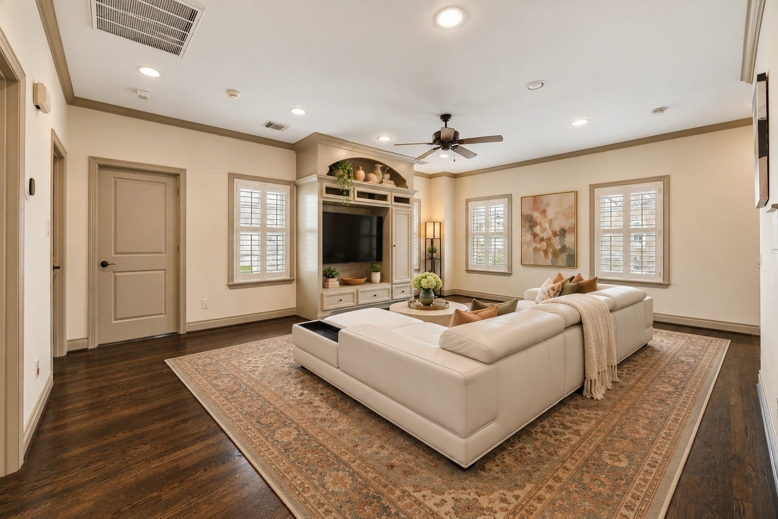 1311 N Jordan Cove, Houston, TX 77055 Another perspective of upstairs game room highlighting four windows w/ plantation shutters that fill the space w/ natural light. Open layout provides wonderful flexibility for a variety of furniture configurations, whether used for movie nights, childrens playroom, games or everyday family enjoyment. Virtually staged.