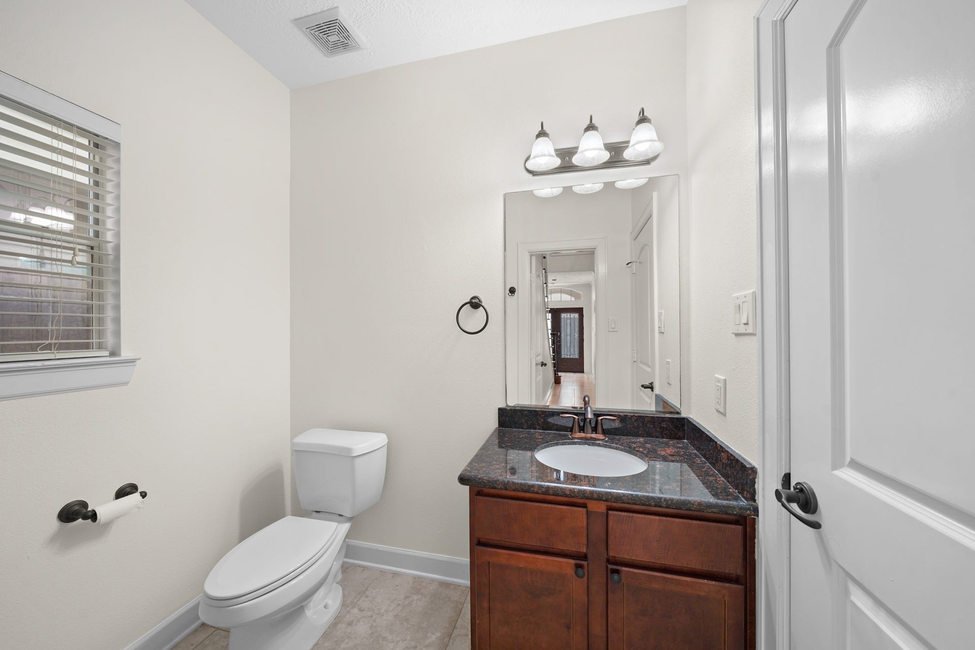 1717 Francis Street, Houston, TX 77004 The first floor bathroom has granite countertops.