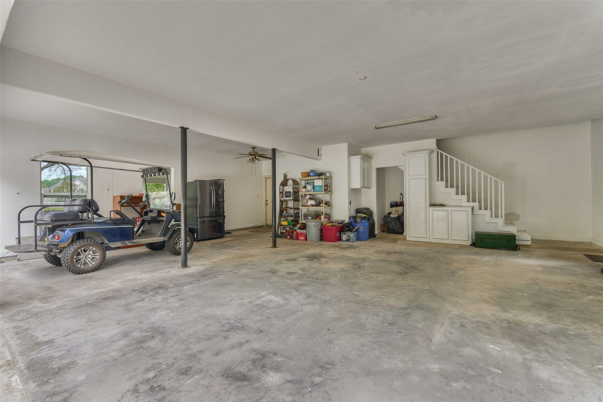 28911 Sapphire Circle, Magnolia, TX 77355 Three car garage with built-ins, staircase to upstairs flex unfinished space.