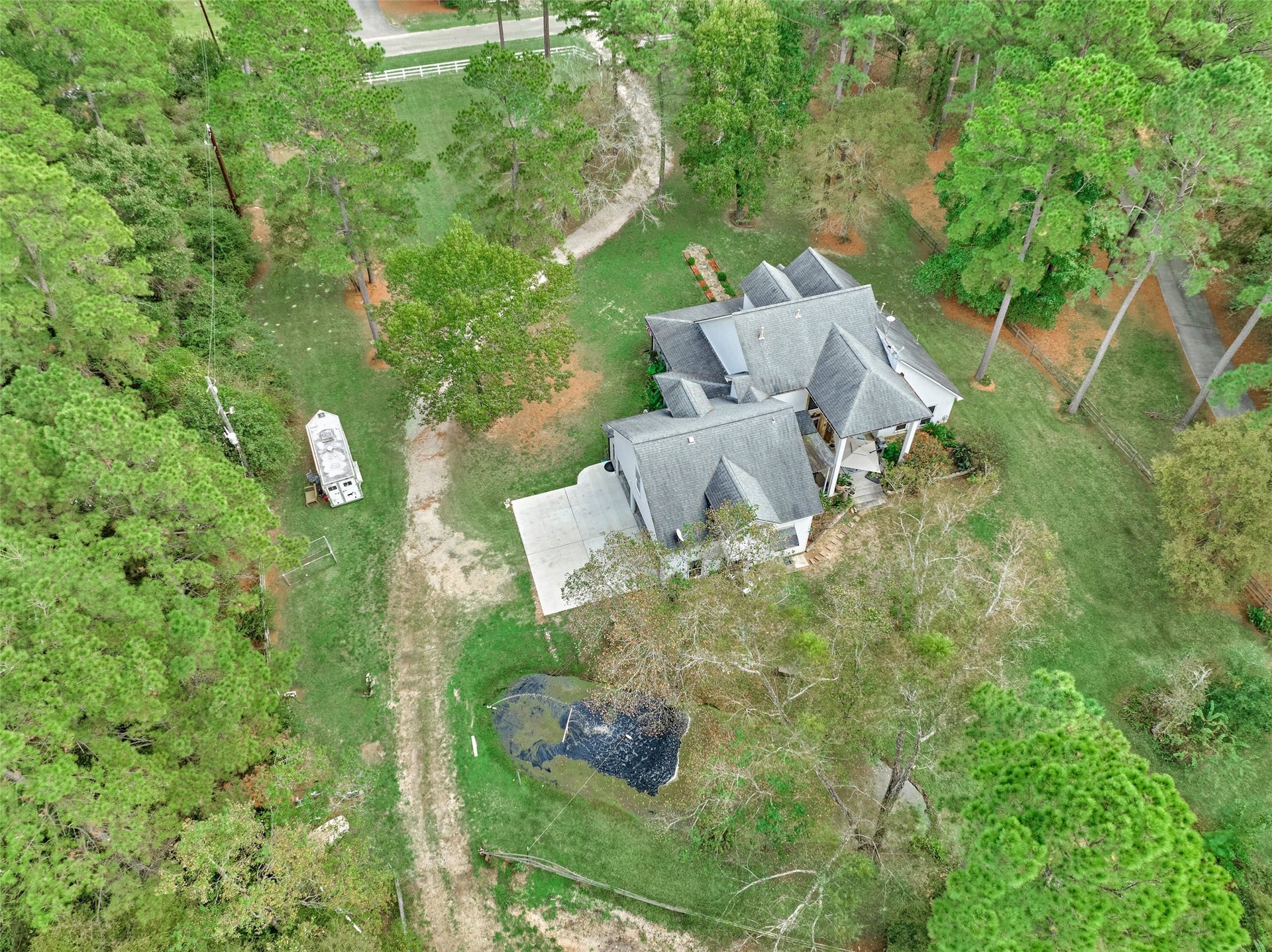 28911 Sapphire Circle, Magnolia, TX 77355 Aerial view of the home, acreage and first pond.