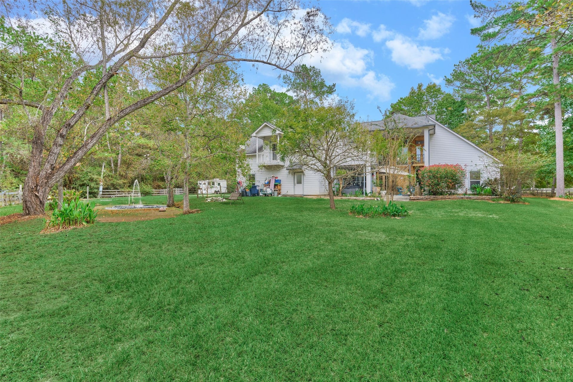 28911 Sapphire Circle, Magnolia, TX 77355 View of back of home/pond/pastures