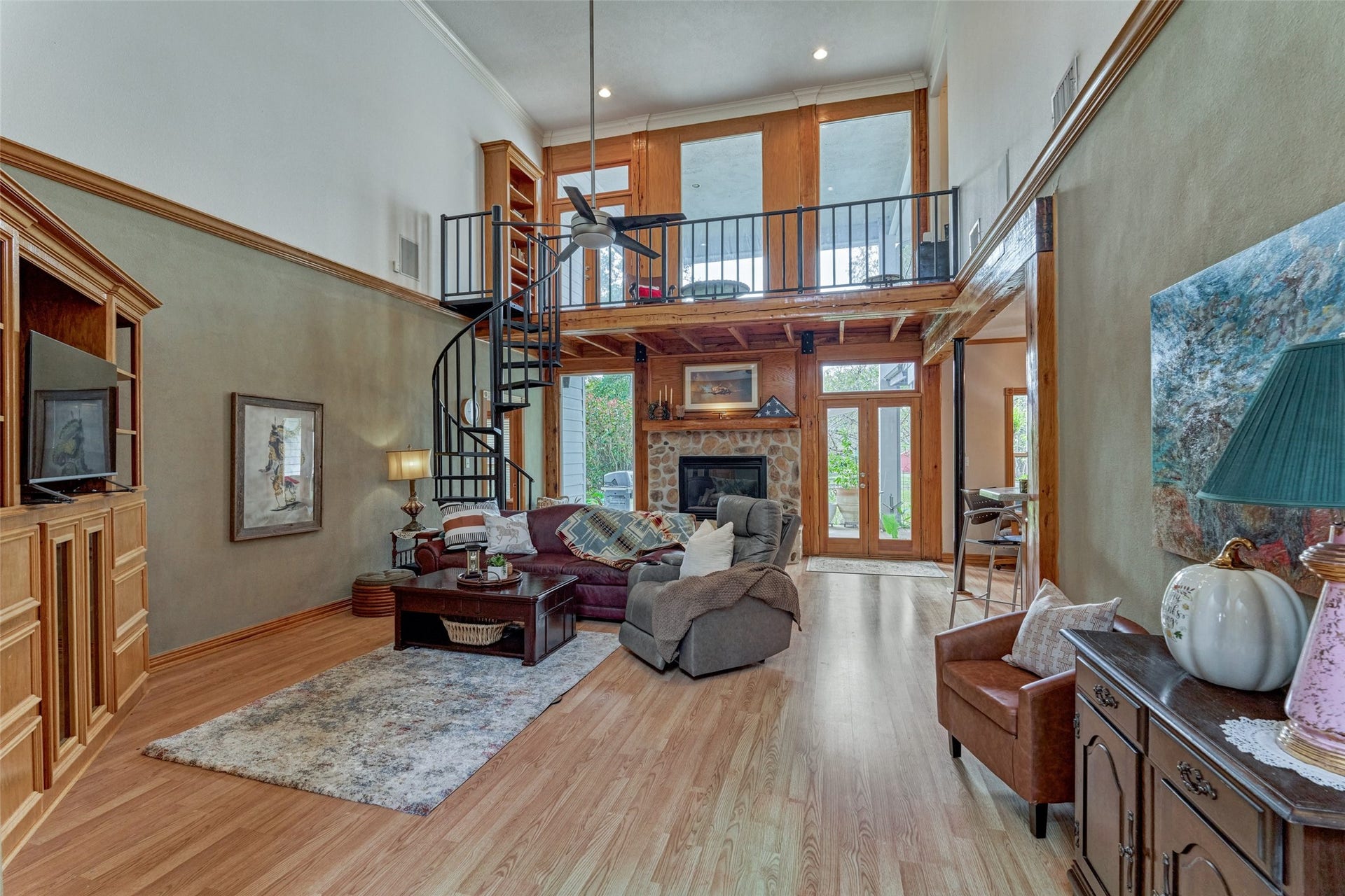 28911 Sapphire Circle, Magnolia, TX 77355 Landing at the top of spiral staircase with view of property and one of two balconies, leading to abundant attic storage and flex unfinished space waiting for your plans!