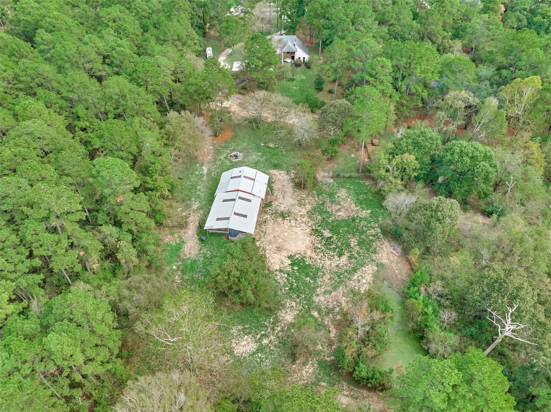 28911 Sapphire Circle, Magnolia, TX 77355 Aerial view of the barns, three acres and second pond.