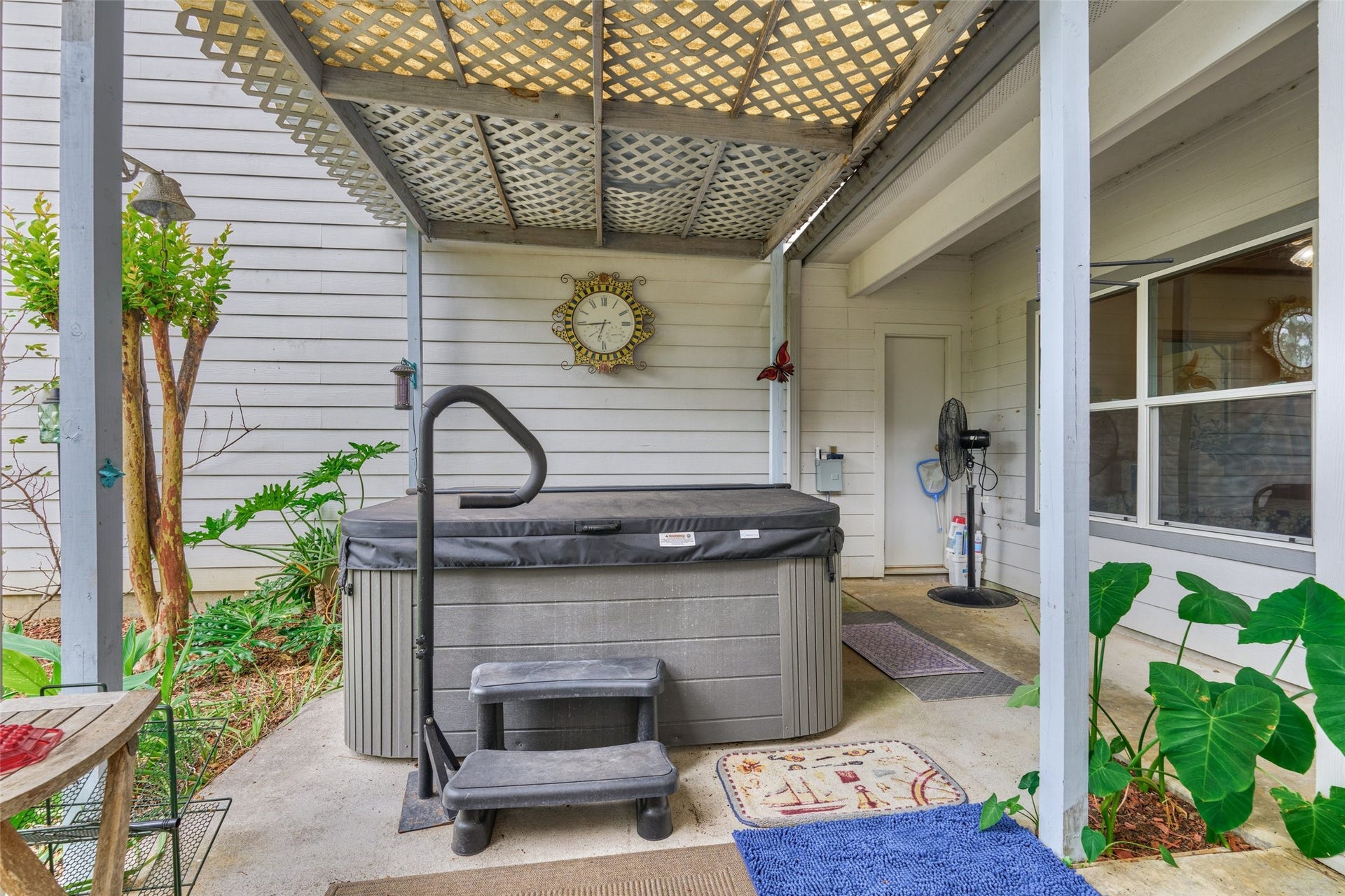 28911 Sapphire Circle, Magnolia, TX 77355 Hot tub on covered back patio is available as a non-realty item or can be removed. Access to half bath/shower from porch.
