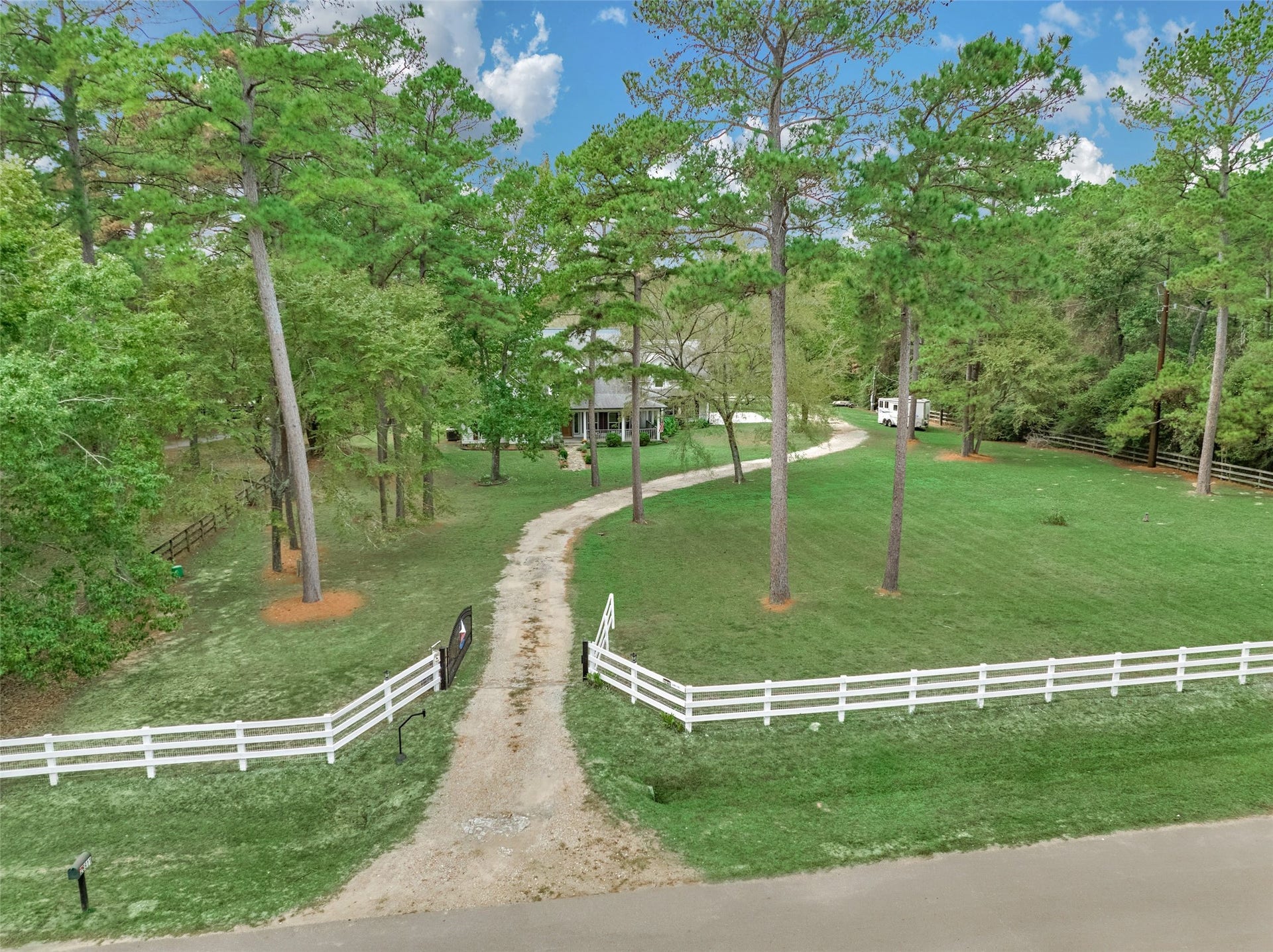 28911 Sapphire Circle, Magnolia, TX 77355 Fully fenced rustic farmhouse and barns waiting for you.