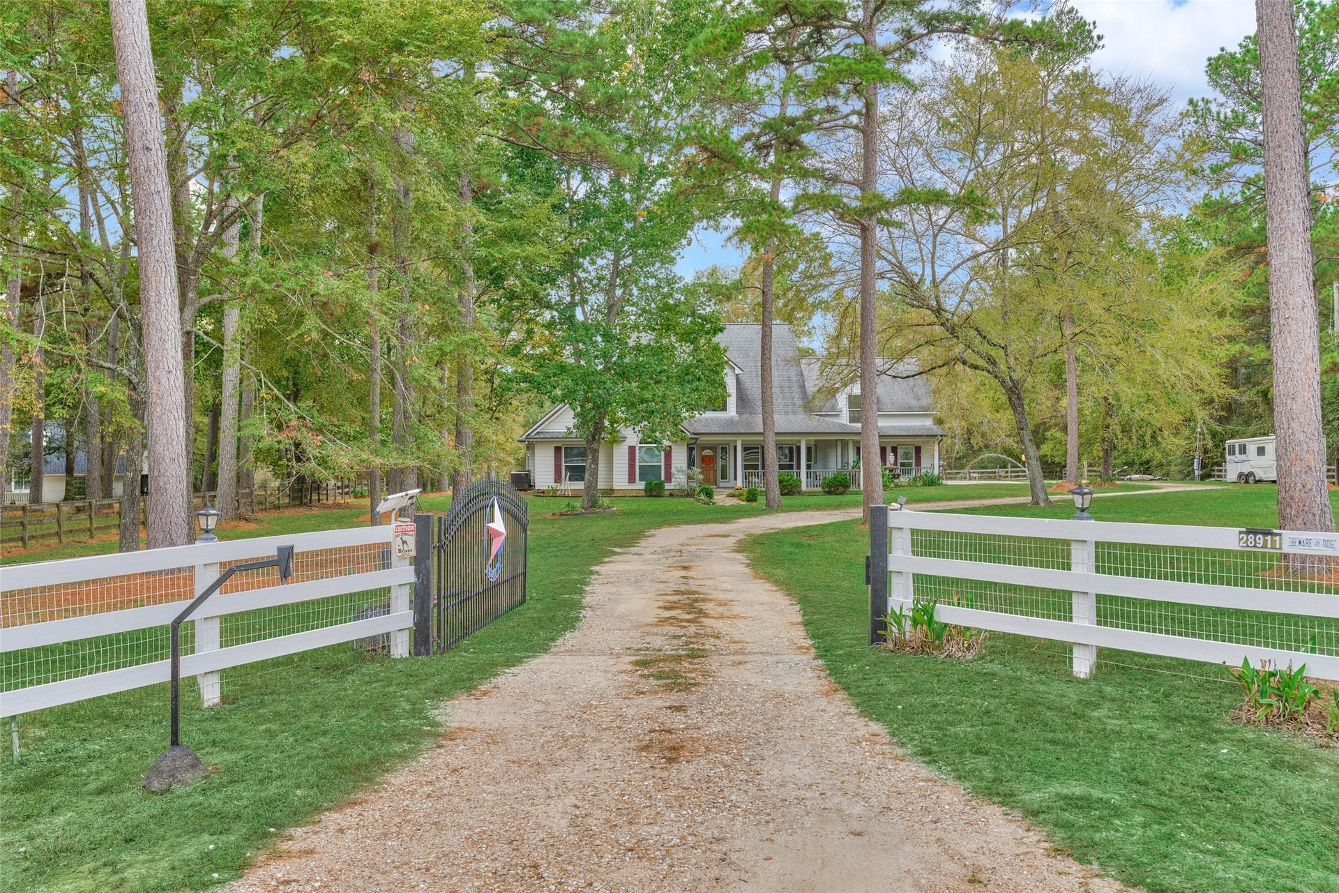 28911 Sapphire Circle, Magnolia, TX 77355 Welcome home to this charming gated country retreat on three acres in Indigo Lake Estates of Magnolia.