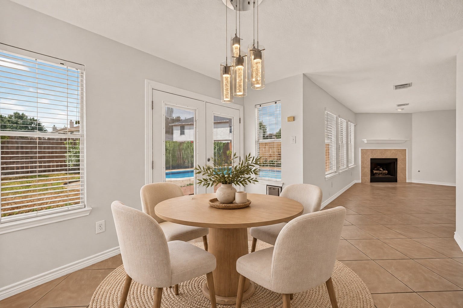 3111 Lantern Bay Lane, Katy, TX 77449 Bright breakfast area overlooking the pool, with direct access to the patio. Virtually staged.