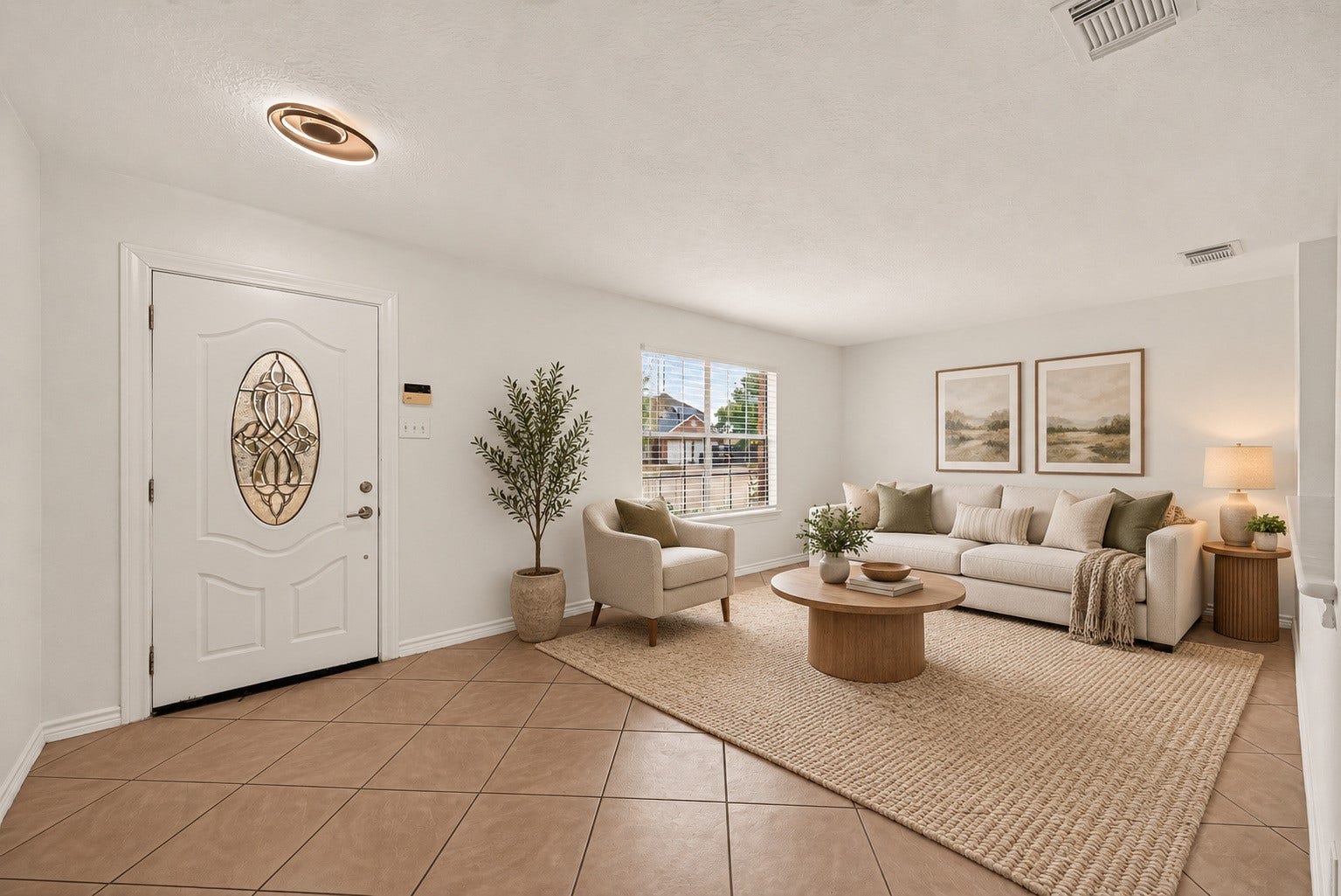3111 Lantern Bay Lane, Katy, TX 77449 Bright living room with space to relax and welcome guests. Virtually staged.