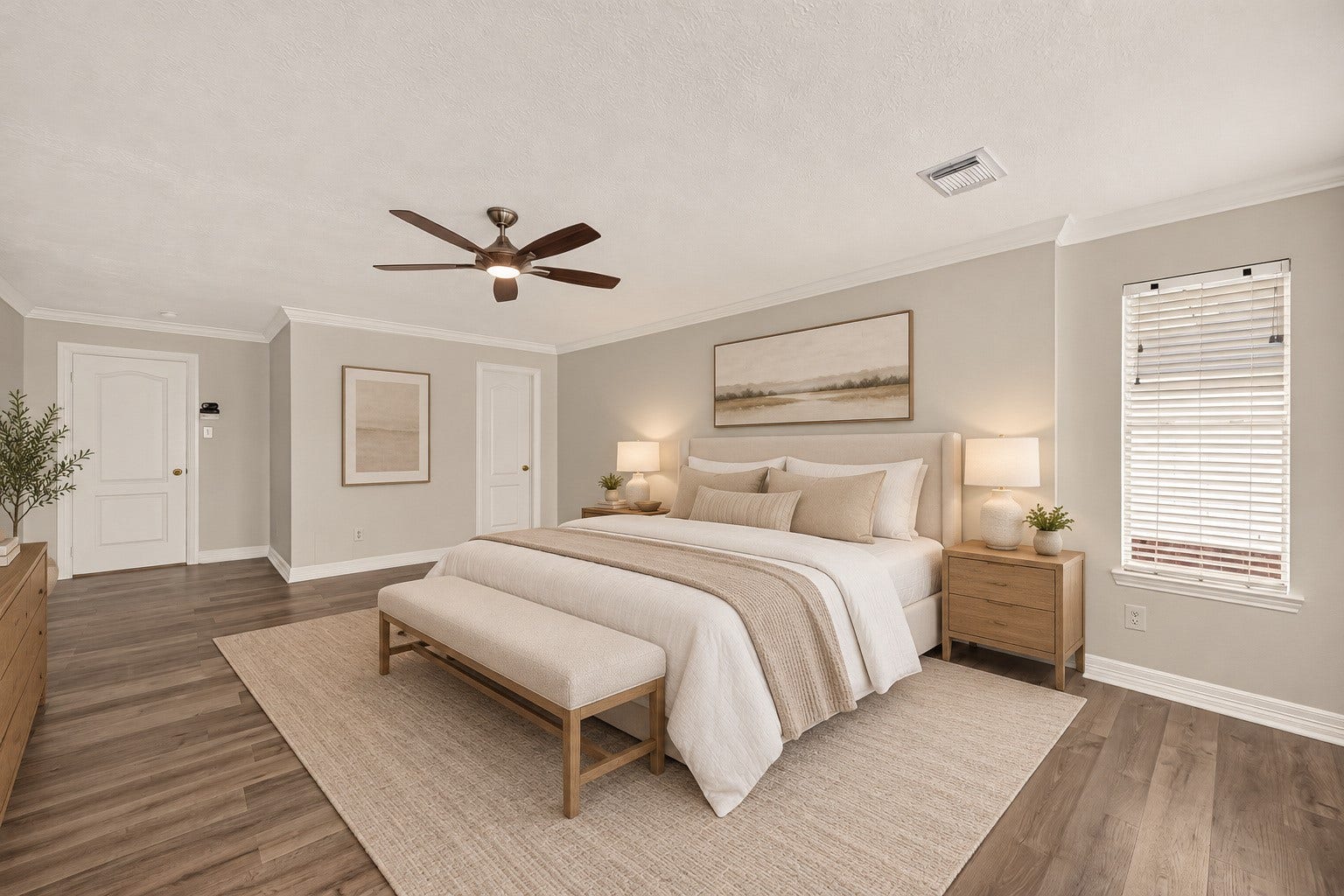 3111 Lantern Bay Lane, Katy, TX 77449 Spacious upstairs primary bedroom with vinyl flooring, crown molding, and a ceiling fan. Virtually staged.