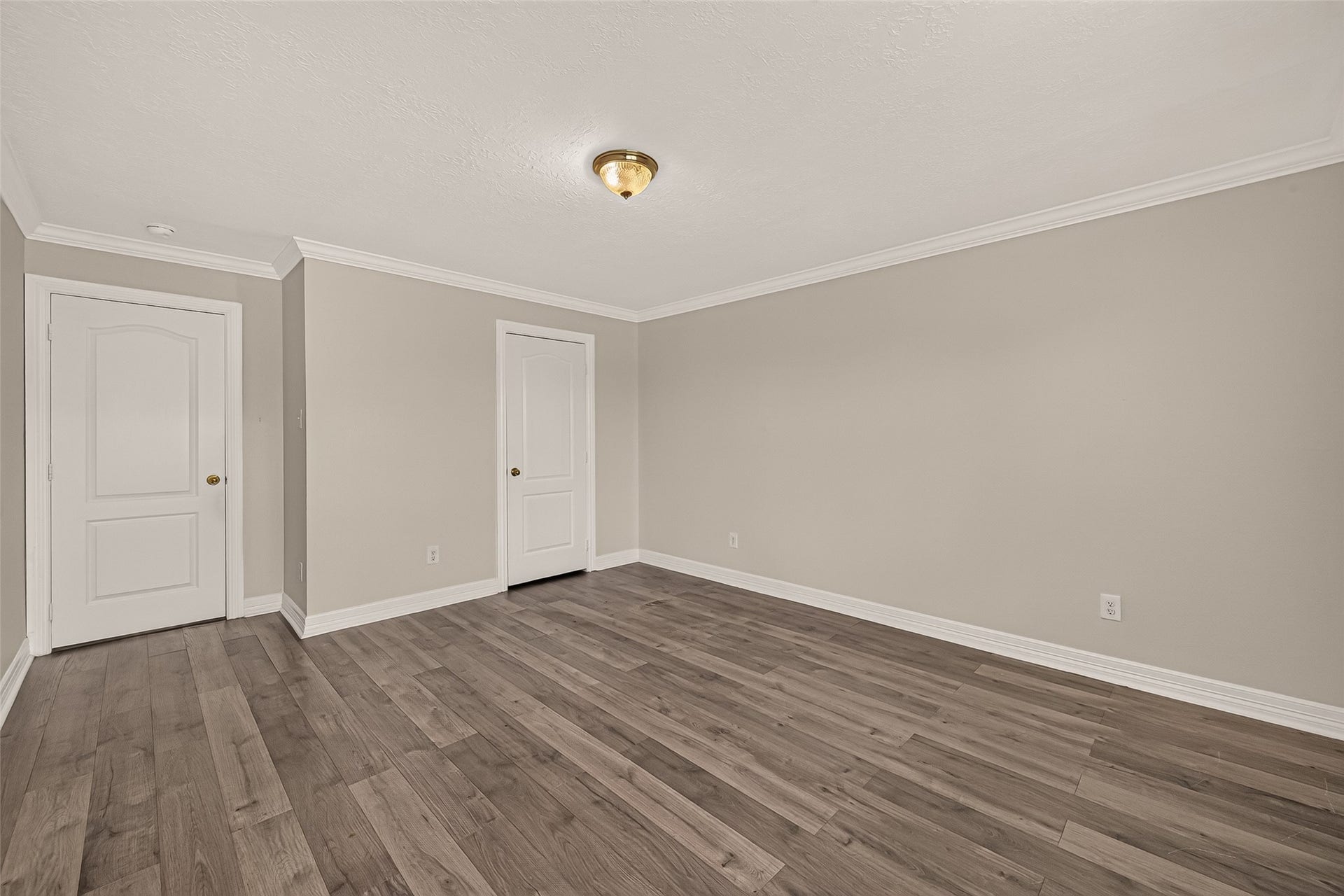 3111 Lantern Bay Lane, Katy, TX 77449 The third guest bedroom offers plenty of space to make it your own, with vinyl flooring, crown molding, and a broad wall ready for your furniture.