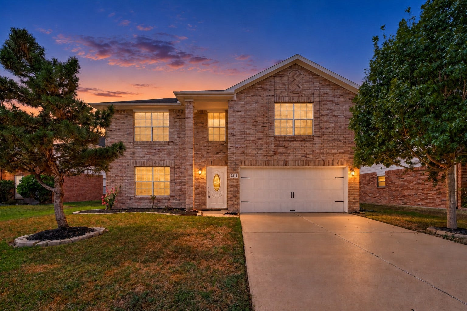 3111 Lantern Bay Lane, Katy, TX 77449 Mature trees and established landscaping add to the inviting curb appeal of this home zoned to Katy ISD.