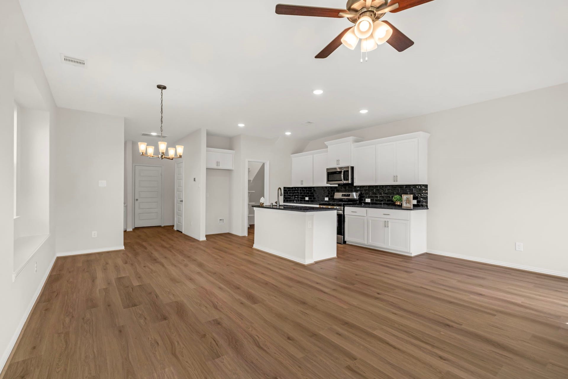 27839 Western Creek Ct, Katy, TX 77494 Beautiful flooring featuring luxury vinyl long planks.
