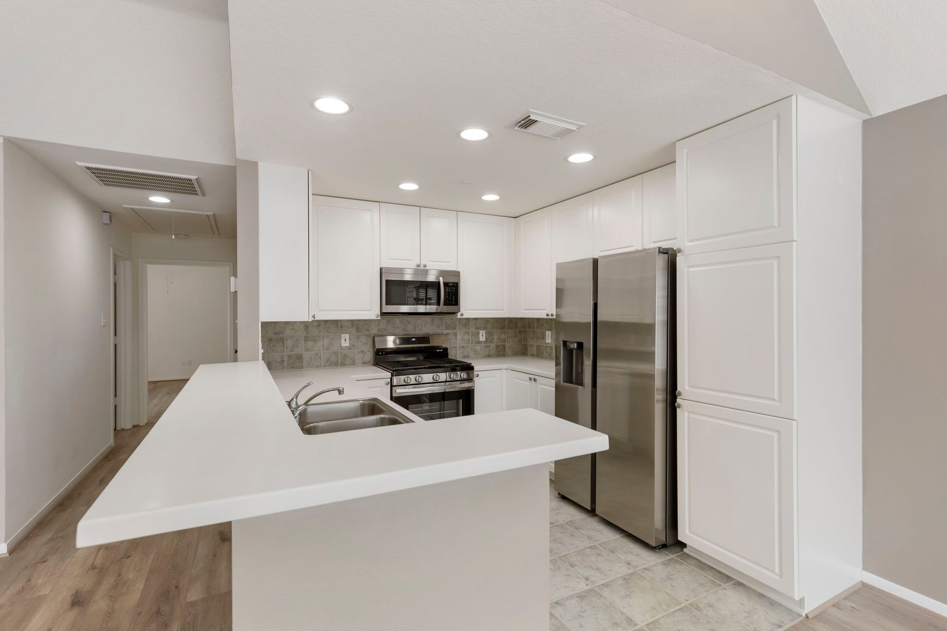 Plenty of counter space and bar space for additional seating.