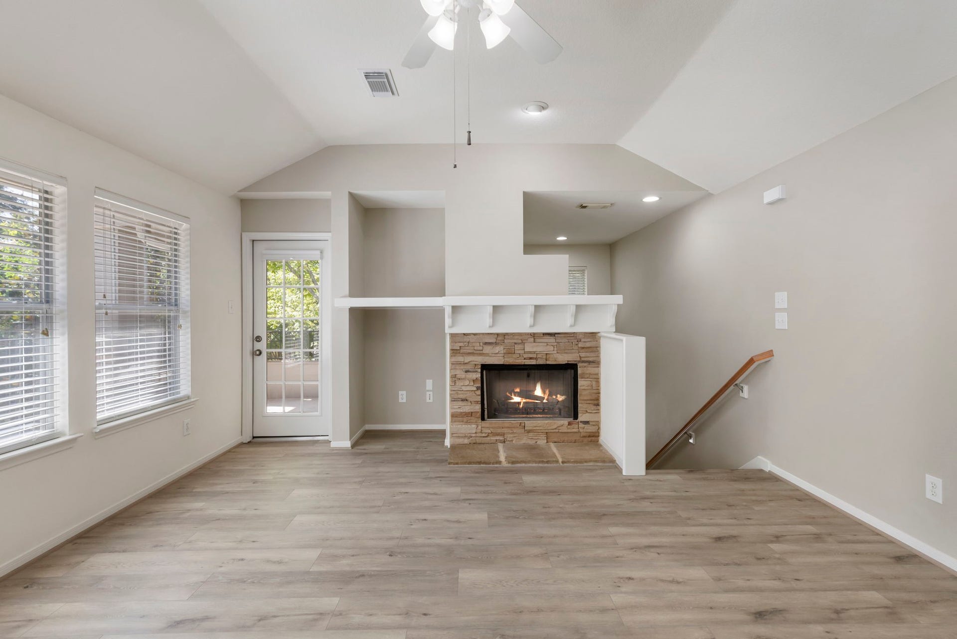 Stone gas log fireplace is a focal point.