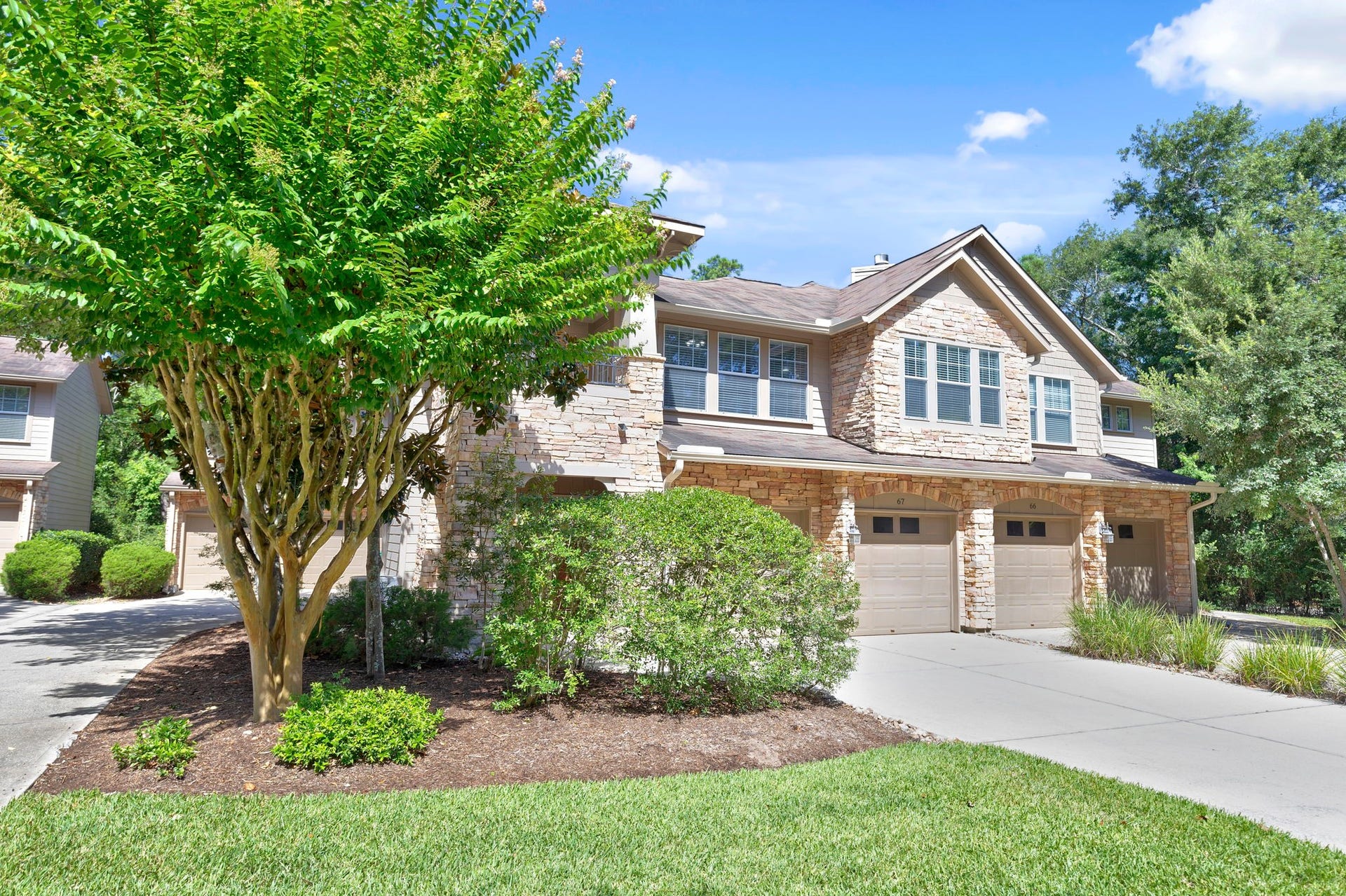 Pretty two story townhome with the garage and laundry on the first floor and living spaces on the second.