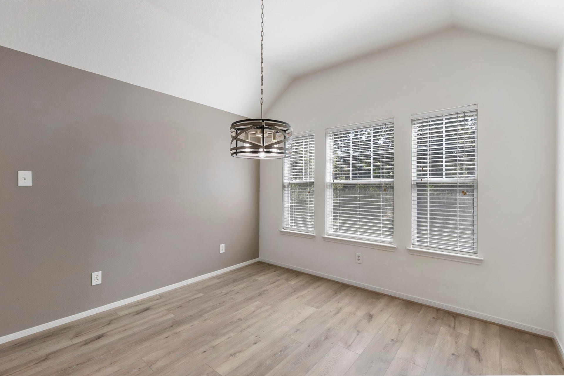 Dining area with new custom lighting.